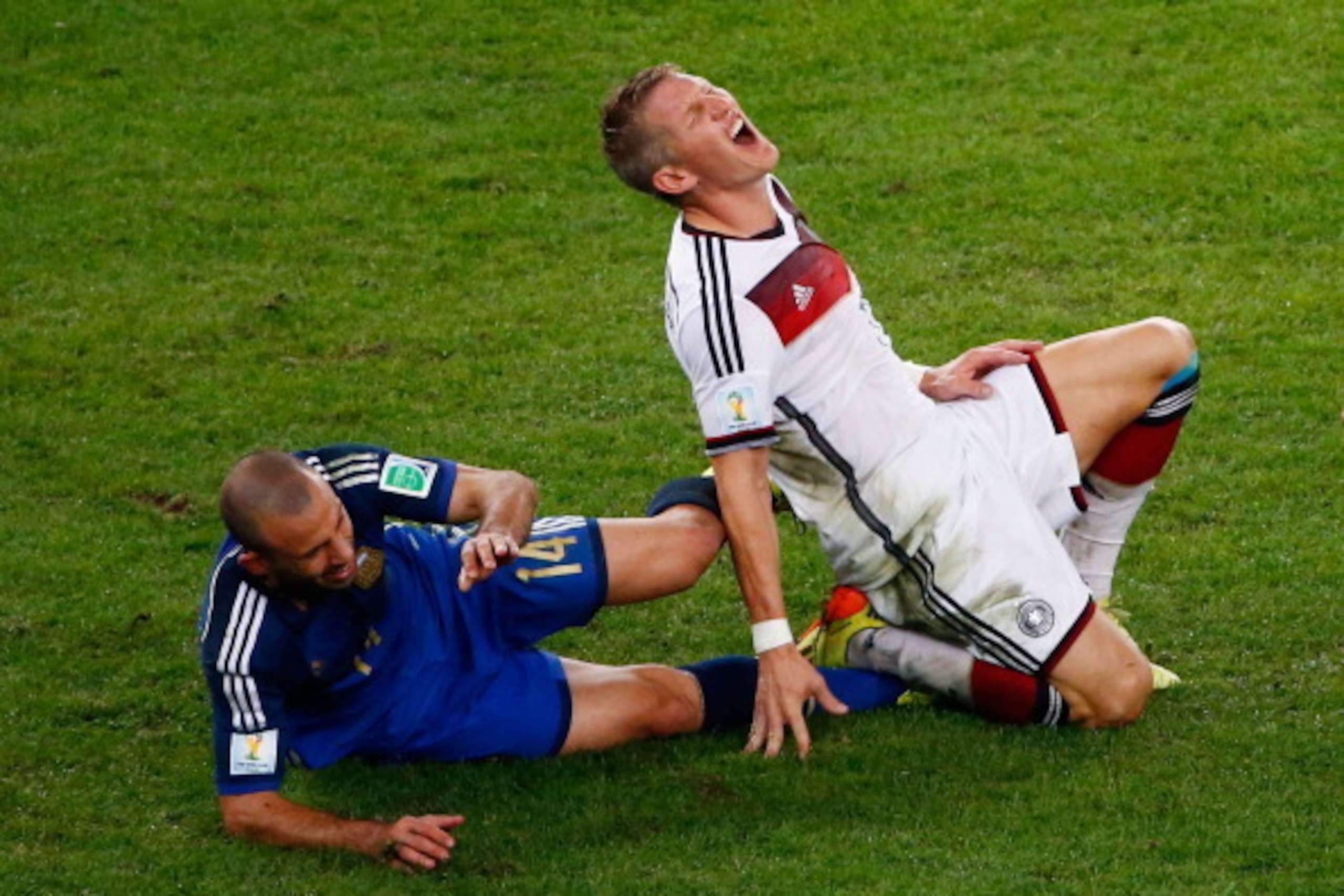 RIO DE JANEIRO, BRAZIL - JULY 13: Javier Mascherano of Argentina challenges Bastian Schweinsteiger of Germany during the 2014 FIFA World Cup Brazil Final match between Germany and Argentina at Maracana on July 13, 2014 in Rio de Janeiro, Brazil.  (Photo b
