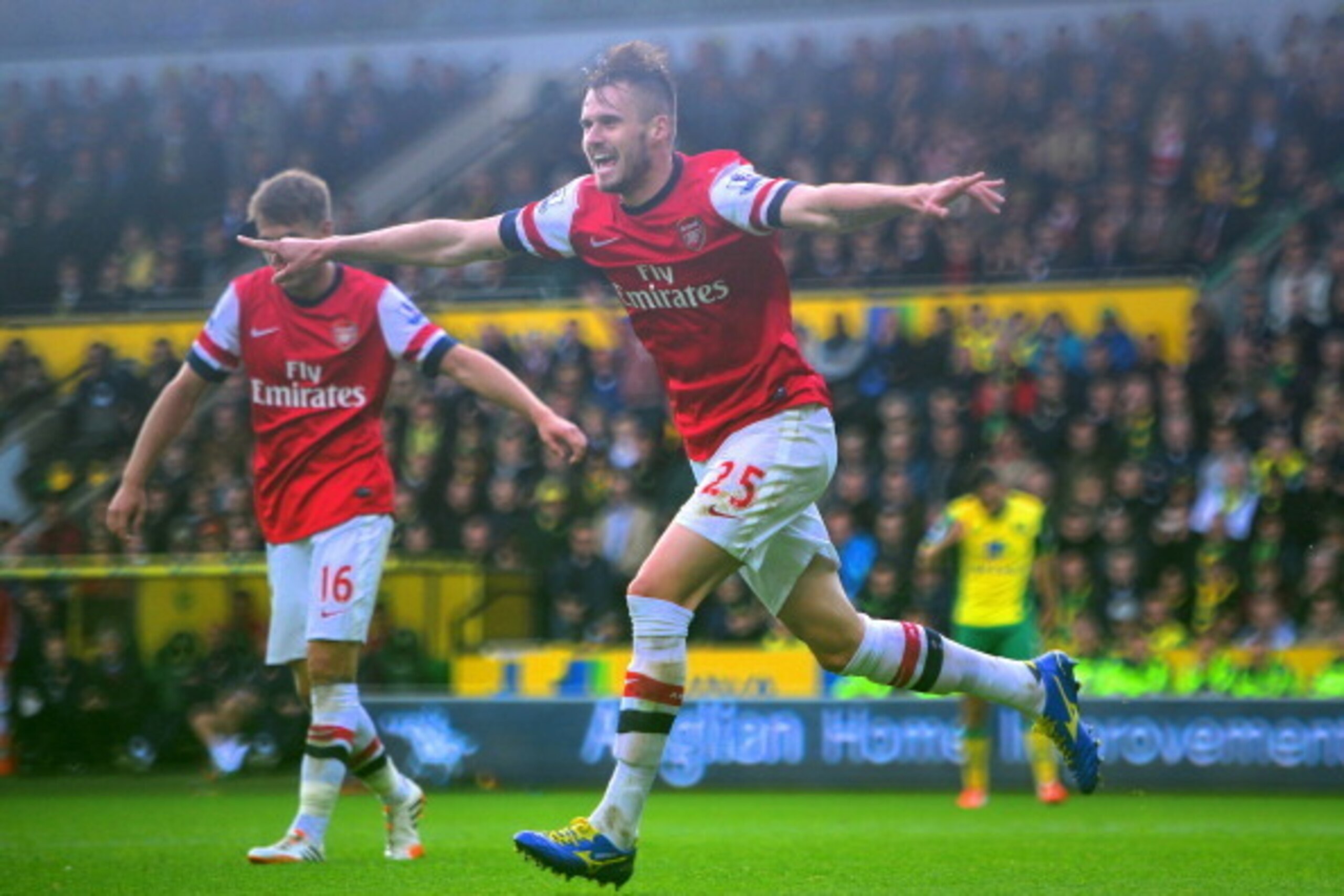 NORWICH, ENGLAND - MAY 11:  Carl Jenkinson of Arsenal celebrates scoring the second goal during the Barclays Premier League match between Norwich City and Arsenal at Carrow Road on May 11, 2014 in Norwich, England.  (Photo by Jamie McDonald/Getty Images)