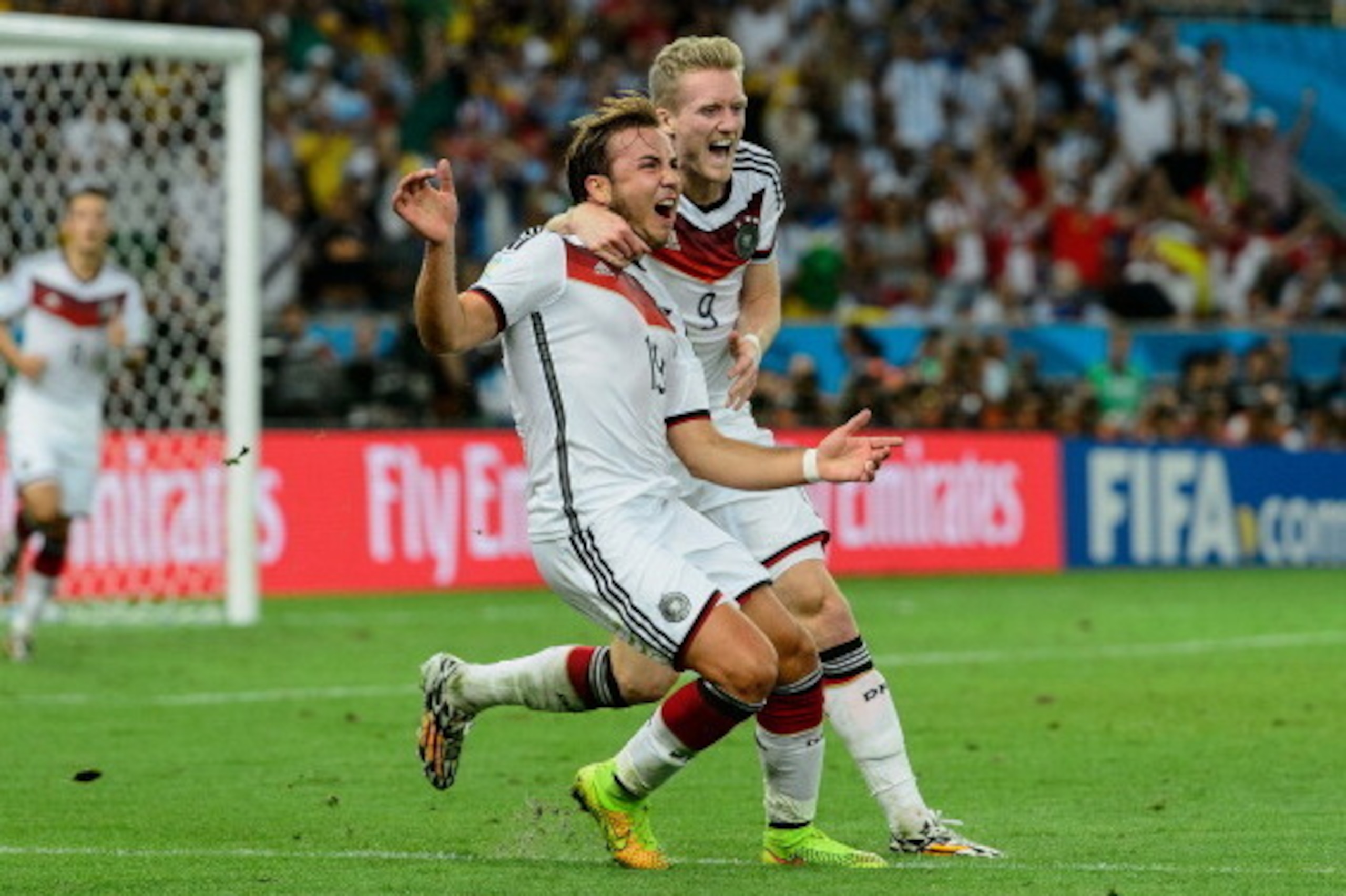 RIO DE JANEIRO, BRAZIL - JULY 13:  Mario Goetze (L) of Germany celebrates scoring his team's first goal with Andre Schuerrle during the 2014 FIFA World Cup Brazil Final match between Germany and Argentina at Maracana on July 13, 2014 in Rio de Janeiro, Br