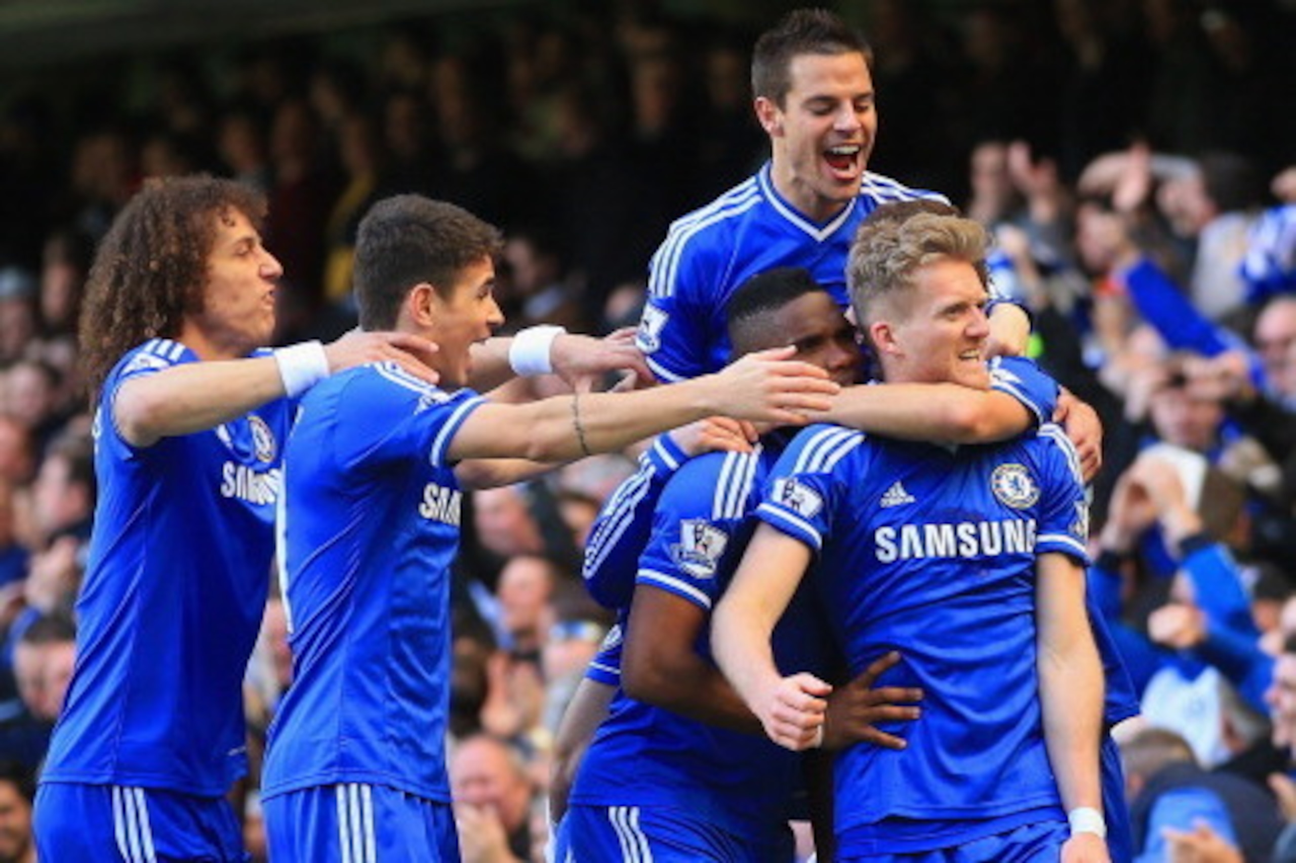 LONDON, ENGLAND - MARCH 22:  Andre Schurrle of Chelsea celebrates scoring his second goal with,  David Luiz, Samuel Eto'o, Oscar, Branislav Ivanovic of Chelsea during the Barclays Premier League match between Chelsea and Arsenal at Stamford Bridge on Marc