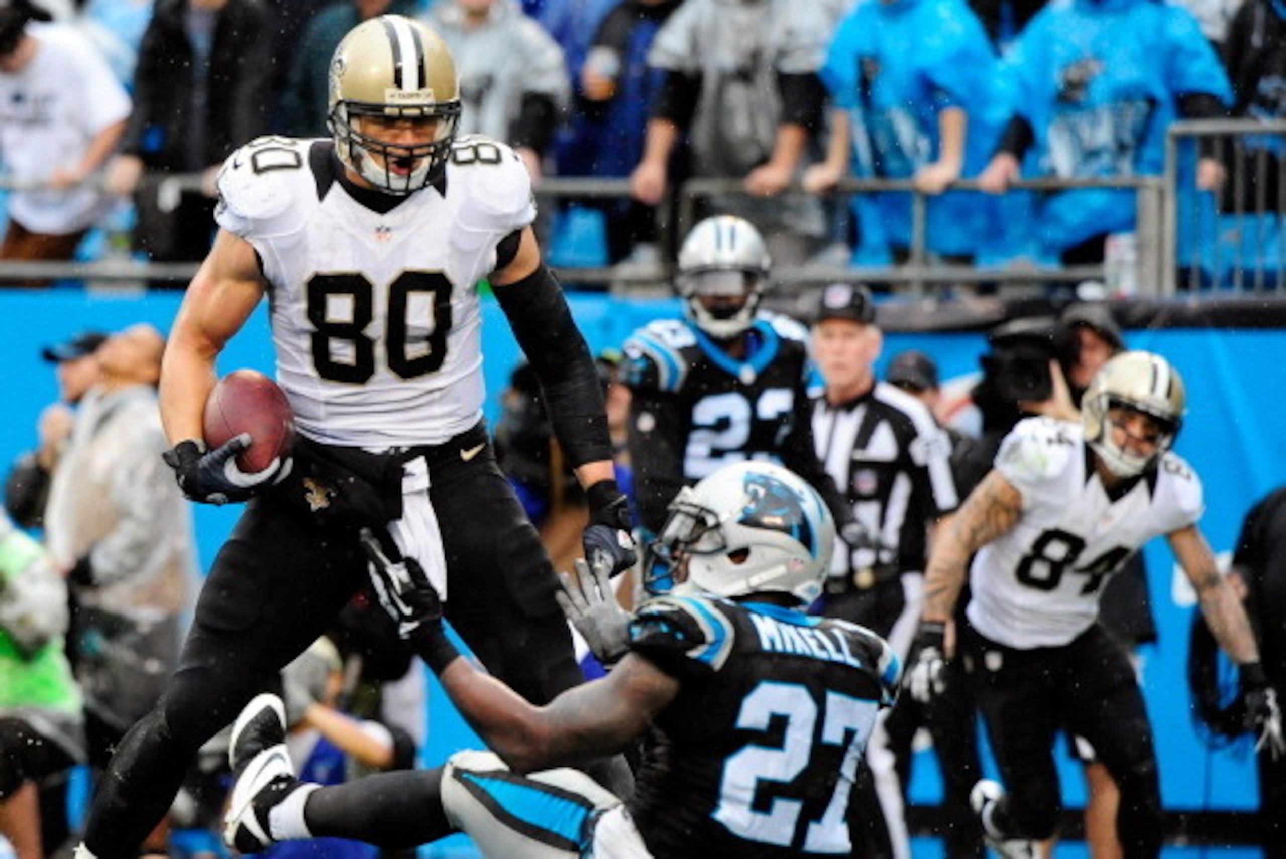 CHARLOTTE, NC - DECEMBER 22:  Jimmy Graham #80 of the New Orleans Saints has words for Quintin Mikell #27 of the Carolina Panthers after beating him for a touchdown during their game at Bank of America Stadium on December 22, 2013 in Charlotte, North Caro