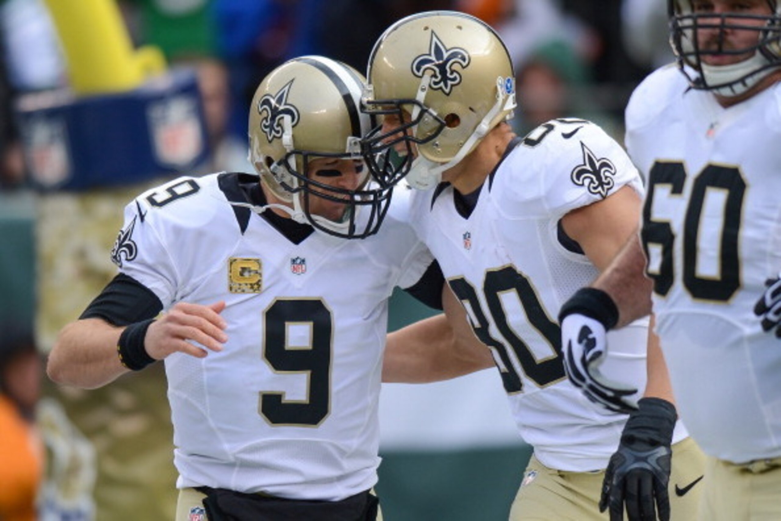 EAST RUTHERFORD, NJ - NOVEMBER 3: Quarterback Drew Brees #9 of the New Orleans Saints celebrates with tight end Jimmy Graham #80 of the New Orleans Saints after his touchdown catch in the 1st  quarter against the New York Jets at MetLife Stadium on Novemb