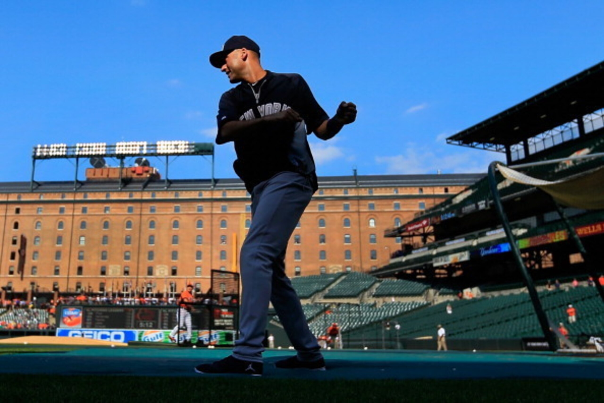 BALTIMORE, MD - JULY 11:  Derek Jeter #2 of the New York Yankees stretches before the start of the game against the Baltimore Orioles at Oriole Park at Camden Yards on July 11, 2014 in Baltimore, Maryland.  (Photo by Rob Carr/Getty Images)