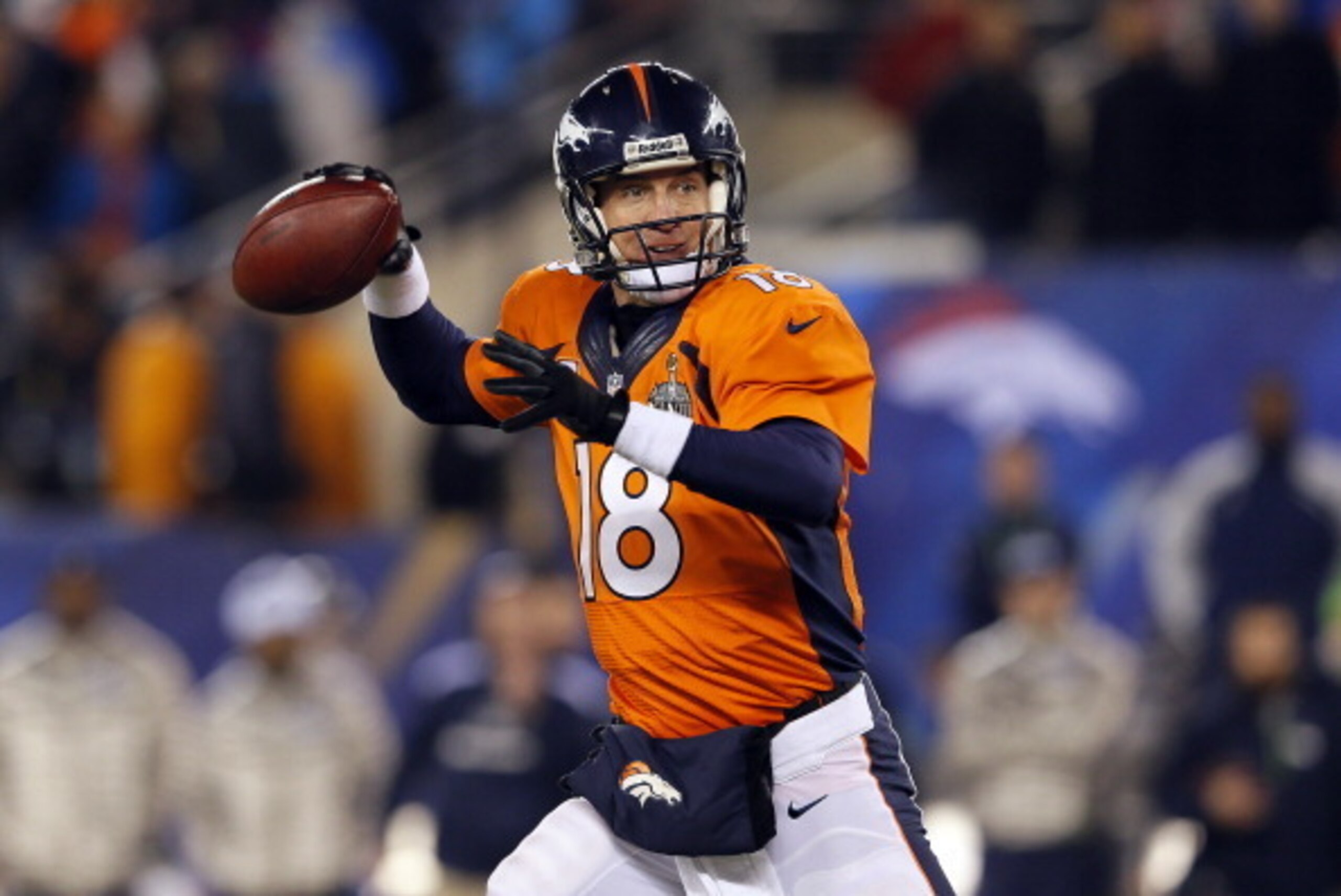 EAST RUTHERFORD, NJ - FEBRUARY 02:  Quarterback Peyton Manning #18 of the Denver Broncos looks to pass against the Seattle Seahawks during Super Bowl XLVIII at MetLife Stadium on February 2, 2014 in East Rutherford, New Jersey.  (Photo by Kevin C. Cox/Get