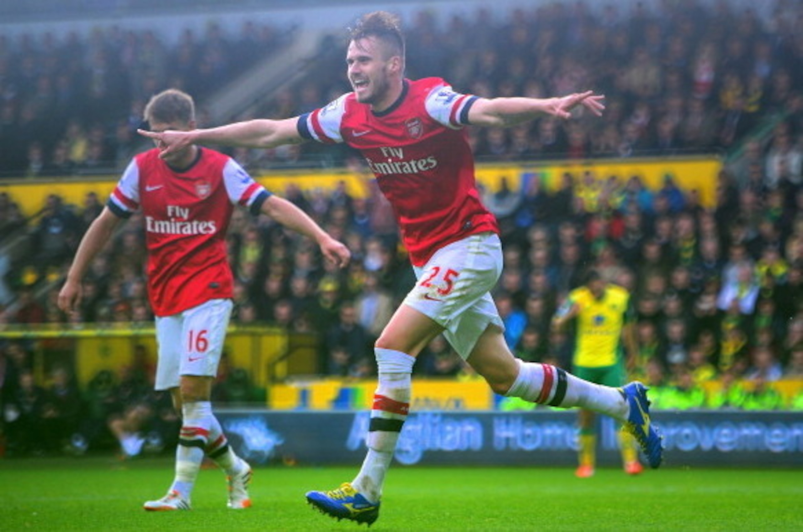 NORWICH, ENGLAND - MAY 11:  Carl Jenkinson of Arsenal celebrates scoring the second goal during the Barclays Premier League match between Norwich City and Arsenal at Carrow Road on May 11, 2014 in Norwich, England.  (Photo by Jamie McDonald/Getty Images)