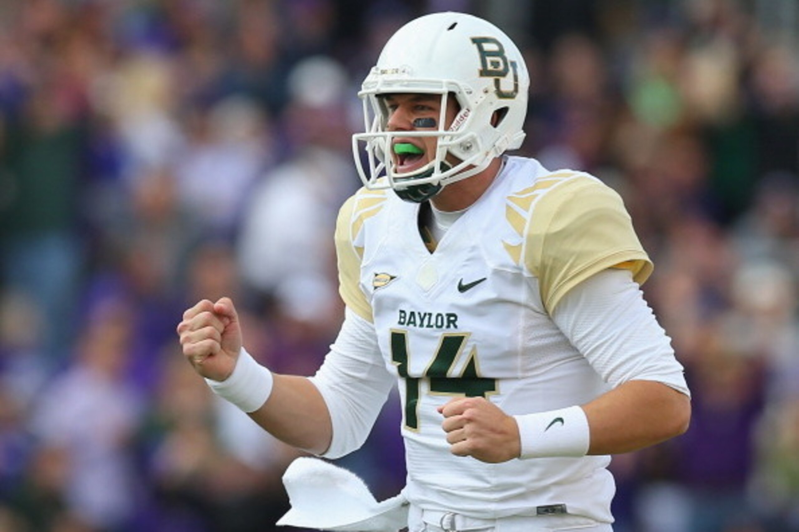 FORT WORTH, TX - NOVEMBER 30:  Bryce Petty #14 of the Baylor Bears celebrates a touchdown against the TCU Horned Frogs at Amon G. Carter Stadium on November 30, 2013 in Fort Worth, Texas.  (Photo by Ronald Martinez/Getty Images)