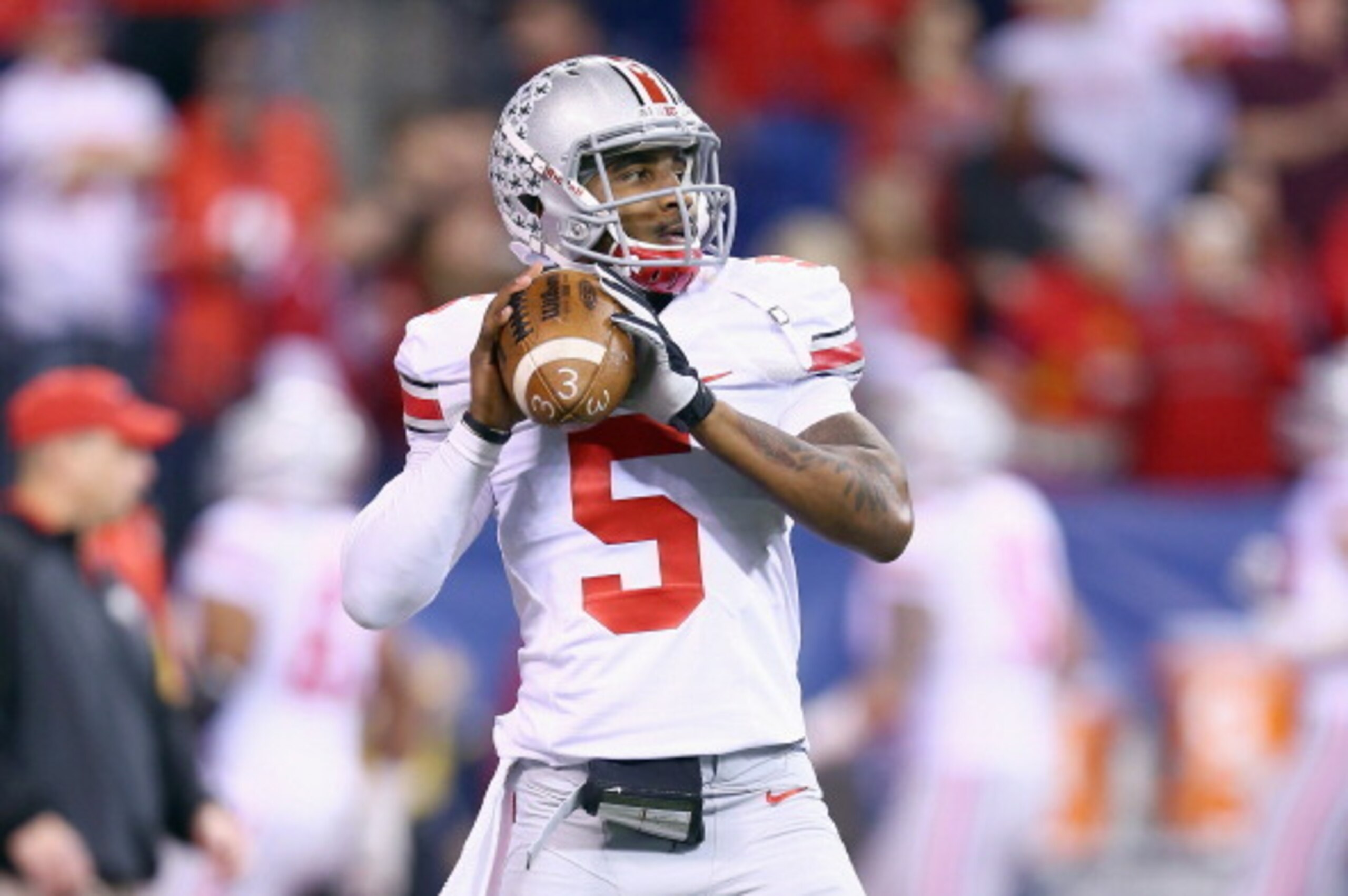 INDIANAPOLIS, IN - DECEMBER 07:  Braxton Miller #5 of the Ohio State Buckeyes throws a pass before the Big Ten Championship against the Michigan State Spartans at Lucas Oil Stadium on December 7, 2013 in Indianapolis, Indiana.  (Photo by Andy Lyons/Getty 
