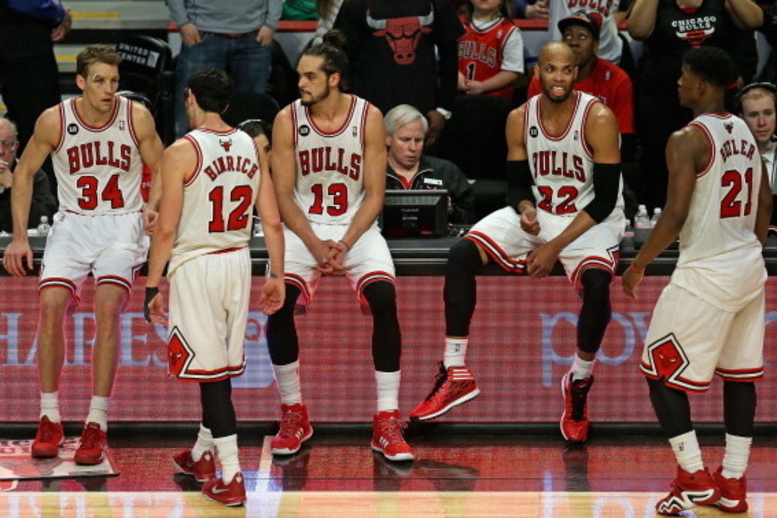 CHICAGO, IL - MARCH 15:  (L-R) Mike Dunleavy #34, Kirk Hinrich #12, Joakim Noah #13, Taj Gibson #22 and Jimmy Butler #21 of the Chicago Bulls wait to reenter a game against the Sacramento Kings after a time out at the United Center on March 15, 2014 in Ch
