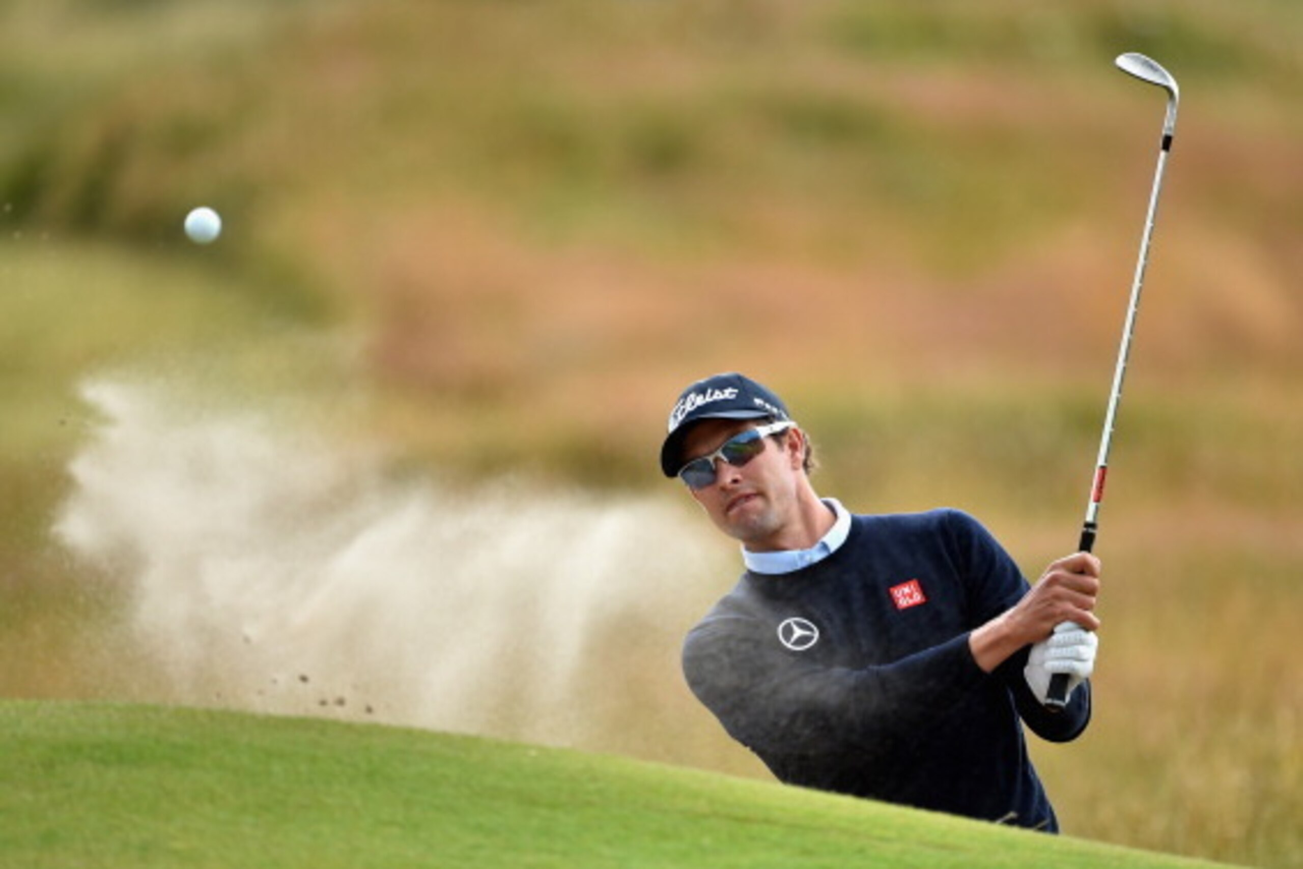 HOYLAKE, ENGLAND - JULY 14:  Adam Scott of Australia hits from a bunker during a practice round prior to the start of the 143rd Open Championship at Royal Liverpool on July 14, 2014 in Hoylake, England.  (Photo by Stuart Franklin/Getty Images)