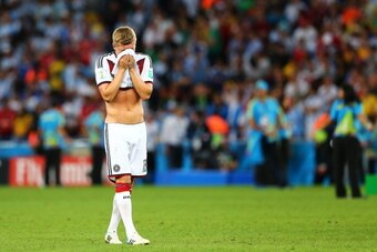 RIO DE JANEIRO, BRAZIL - JULY 13:  Toni Kroos r of Germany celebrates  after defeating Argentina 1-0 in extra time during the 2014 FIFA World Cup Brazil Final match between Germany and Argentina at Maracana on July 13, 2014 in Rio de Janeiro, Brazil.  (Ph
