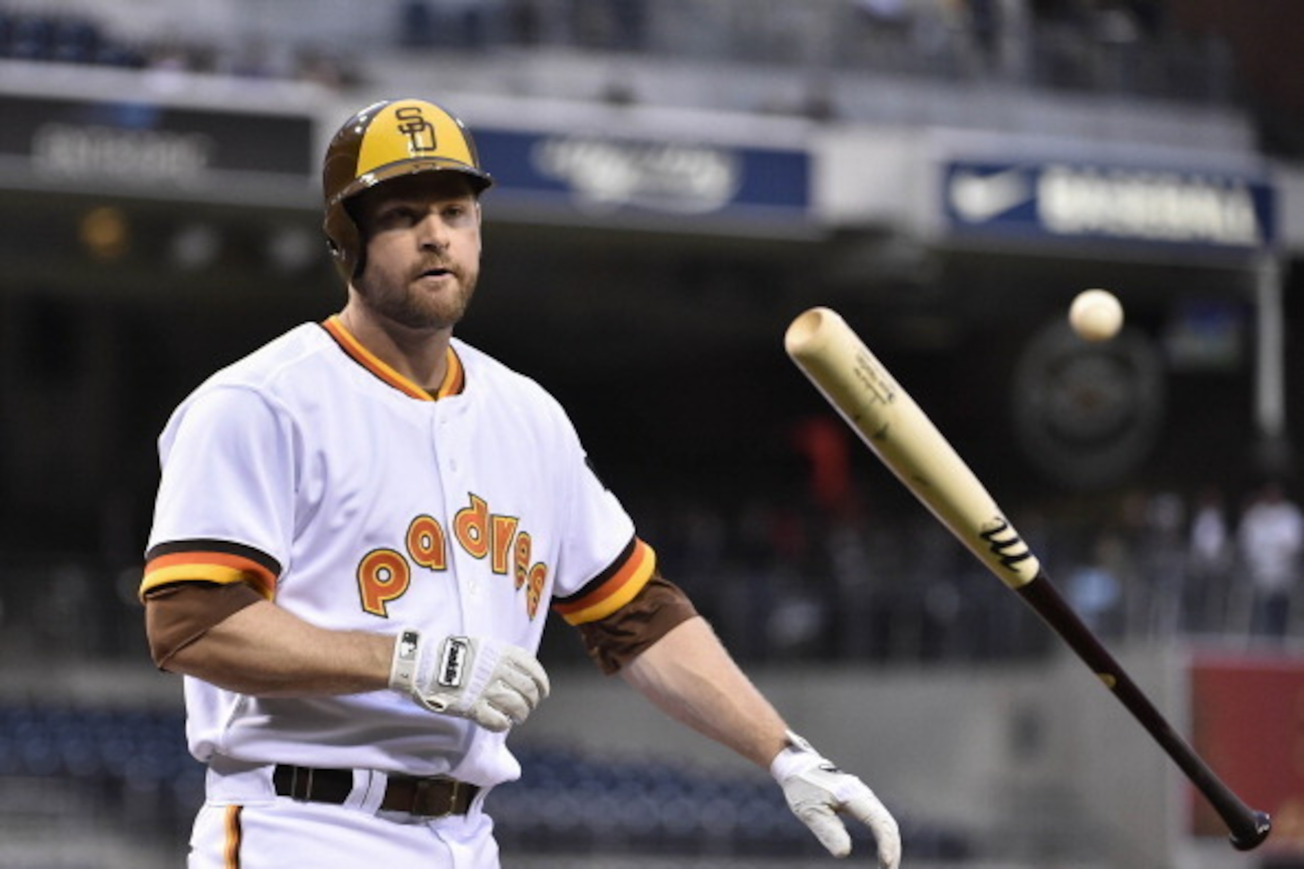 SAN DIEGO, CA - MAY 22:  San Diego Padres Chase Headley #7 tosses his bat after striking out during the first inning of a baseball game against the Chicago Cubs at Petco Park May 22, 2014 in San Diego, California.  (Photo by Denis Poroy/Getty Images)