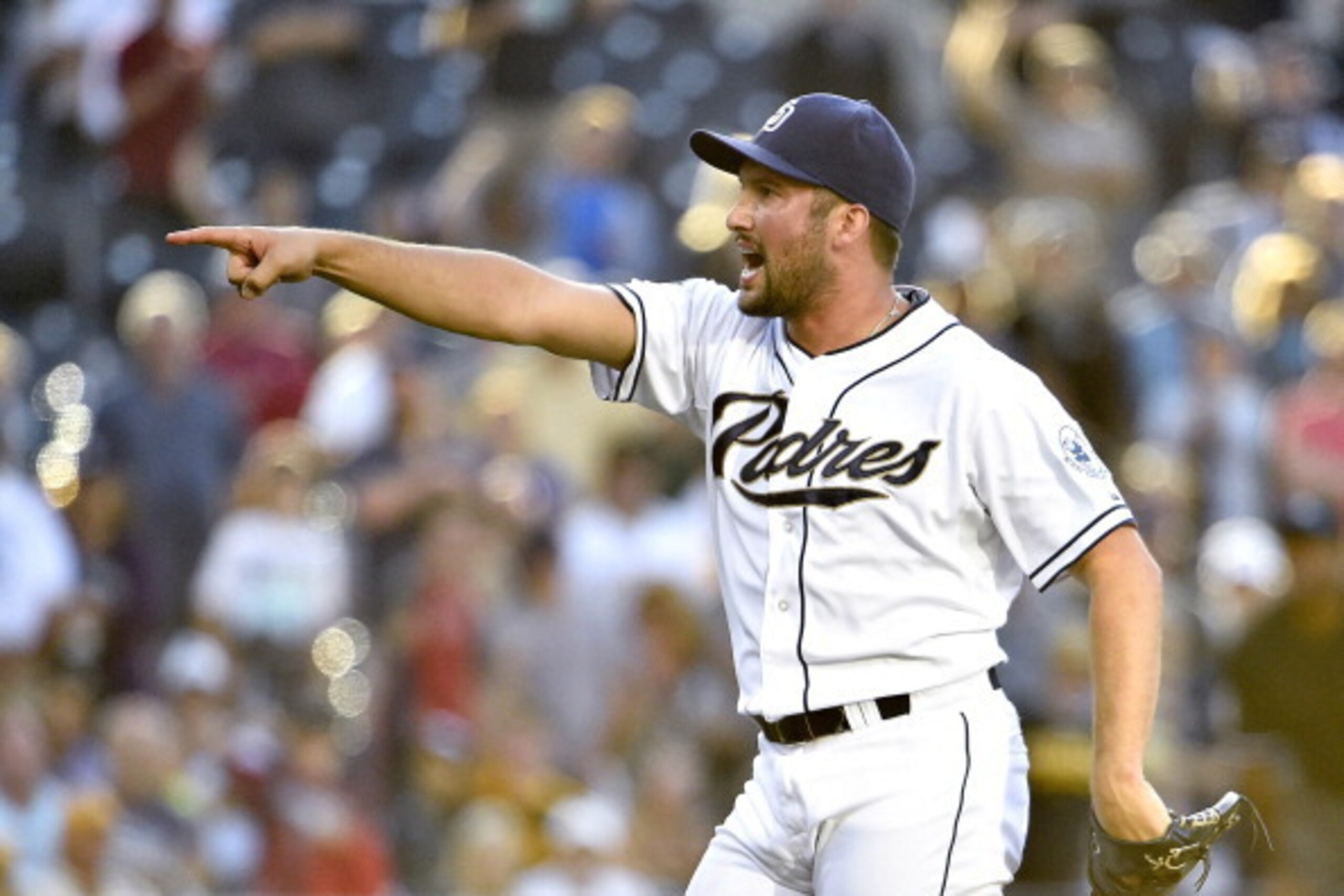 SAN DIEGO, CA - JUNE 4:  Huston Street #16 of the San Diego Padres points after striking out Russell Martin #55 of the Pittsburgh Pirates for the final out during the ninth inning of a baseball game at Petco Park June 4, 2014 in San Diego, California.  (P