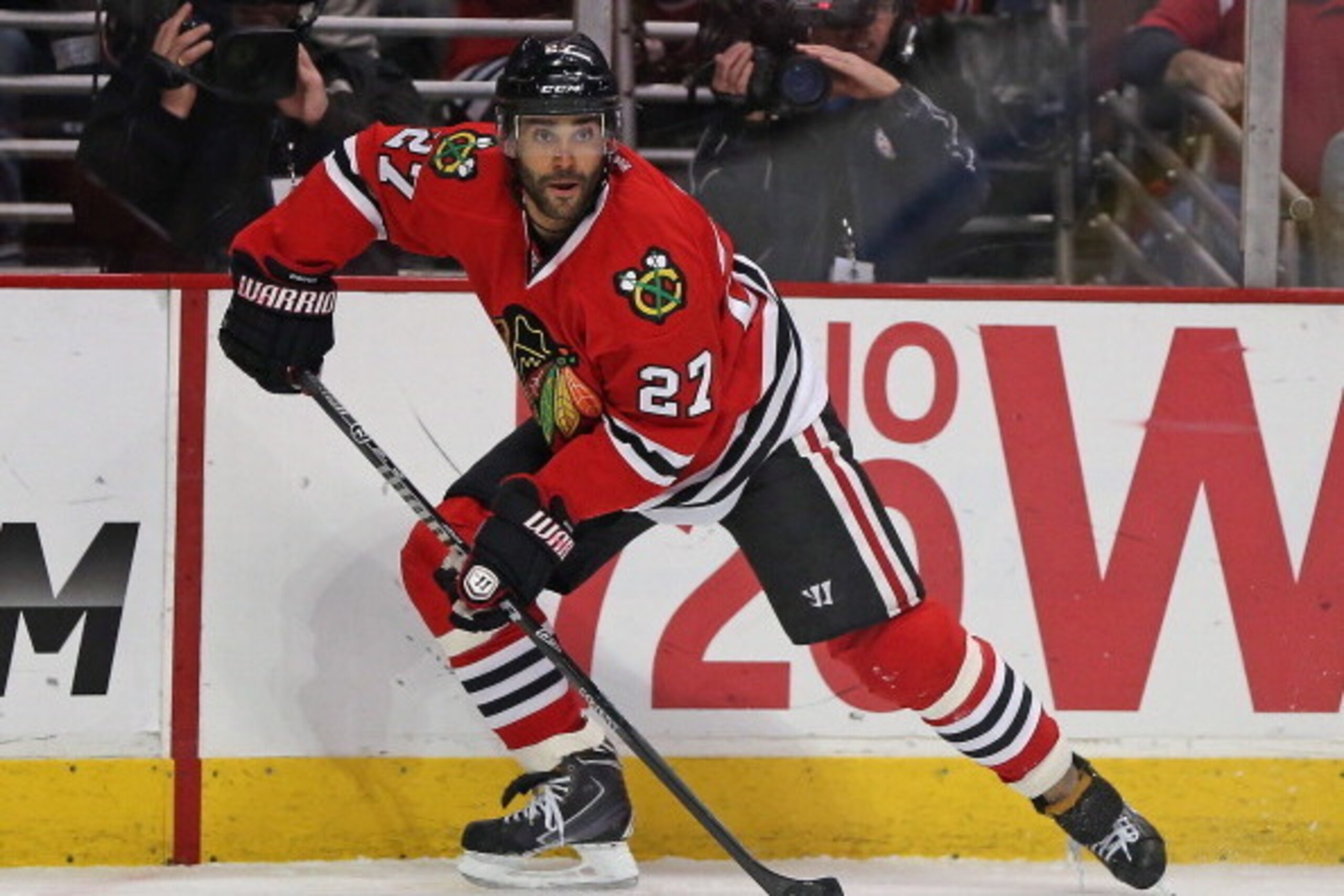 CHICAGO, IL - APRIL 27: Johnny Oduya #27 of the Chicago Blackhawks looks to pass against the St. Louis Blues in Game Six of the First Round of the 2014 NHL Stanley Cup Playoffs at the United Center on April 27, 2014  in Chicago, Illinois. The Blackhawks d