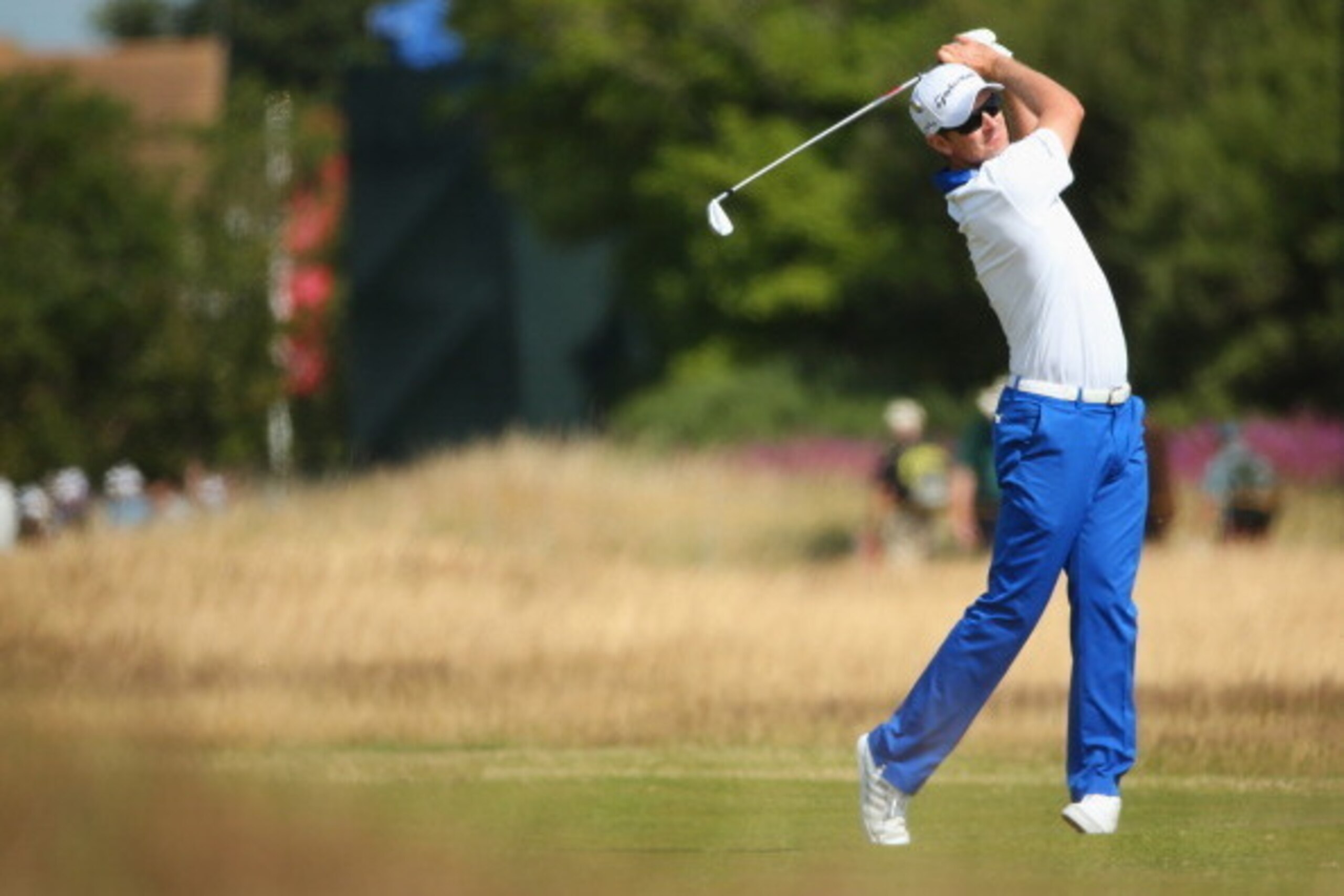 HOYLAKE, ENGLAND - JULY 15:  Justin Rose of England watches a shot during a practice round prior to the start of The 143rd Open Championship at Royal Liverpool on July 15, 2014 in Hoylake, England.  (Photo by Mike Ehrmann/Getty Images)