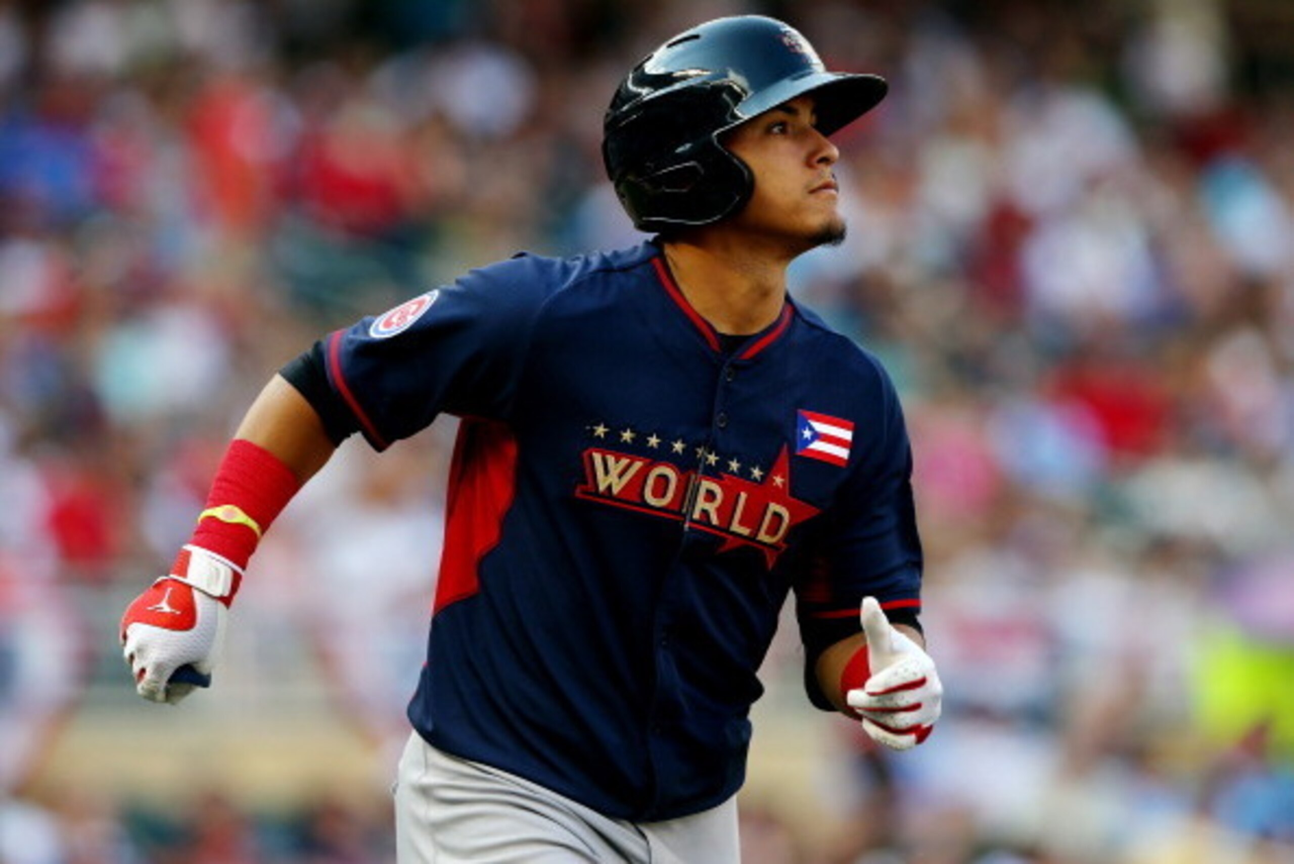 MINNEAPOLIS, MN - JULY 13:  Javier Baez of the World Team rounds the bases after hitting a two-run home run against the U.S. Team during the SiriusXM All-Star Futures Game at Target Field on July 13, 2014 in Minneapolis, Minnesota.  (Photo by Elsa/Getty I