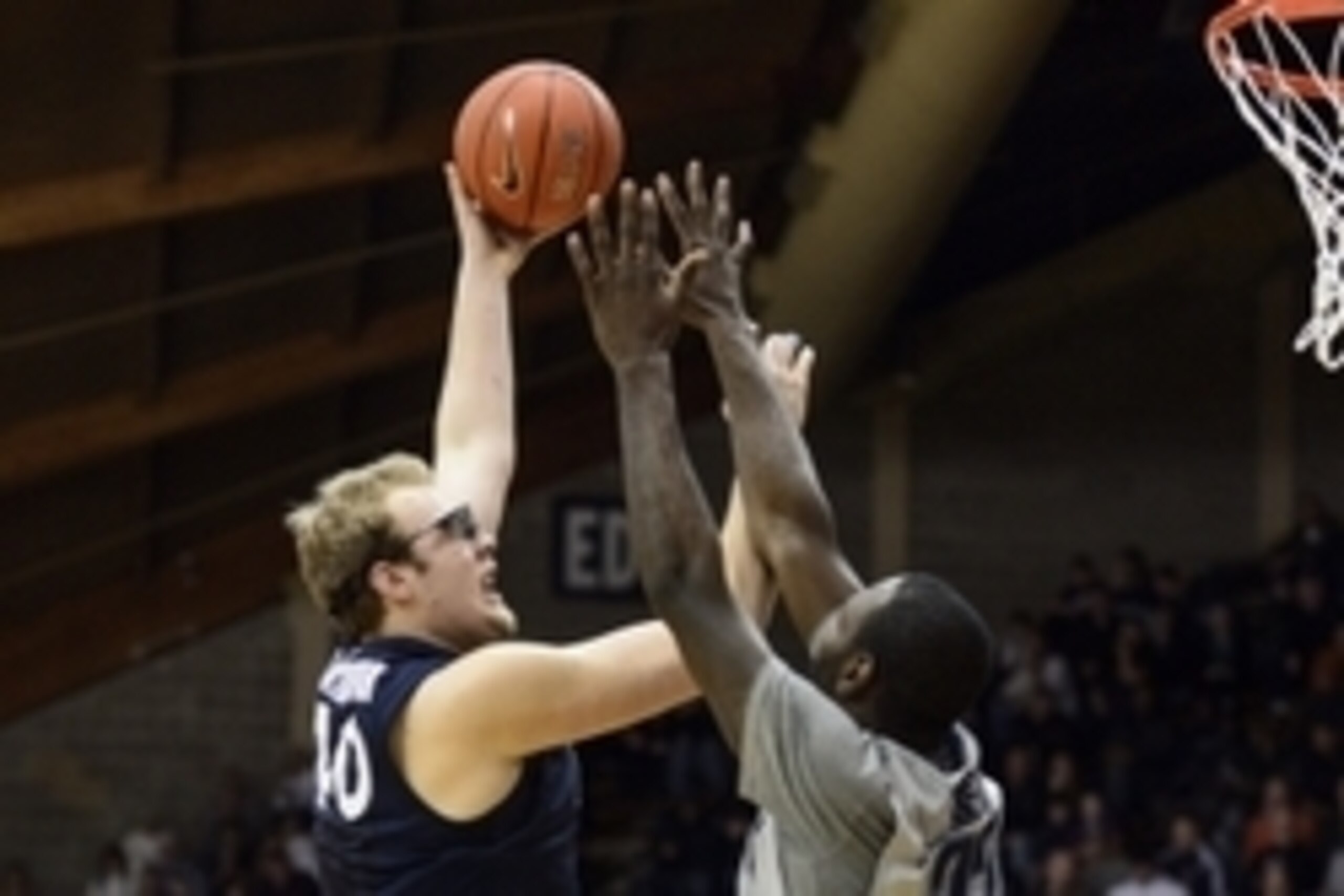 Feb 3, 2014; Villanova, PA, USA; Xavier Musketeers center Matt Stainbrook (40) shoots under pressure from Villanova Wildcats forward JayVaughn Pinkston (22) during the second half at The Pavilion. Villanova defeated Xavier 81-58. Mandatory Credit: Howard 