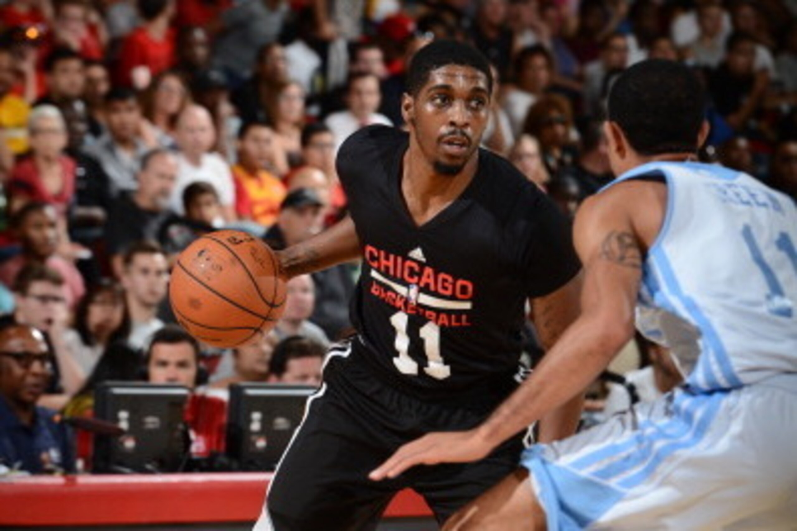 LAS VEGAS, NV - JULY 13:  Lazeric Jones #11 of the Chicago Bulls handles the ball against the Denver Nuggets at the Samsung NBA Summer League 2014 on July 13, 2014 at the Cox Pavilion in Las Vegas, Nevada. NOTE TO USER: User expressly acknowledges and agr