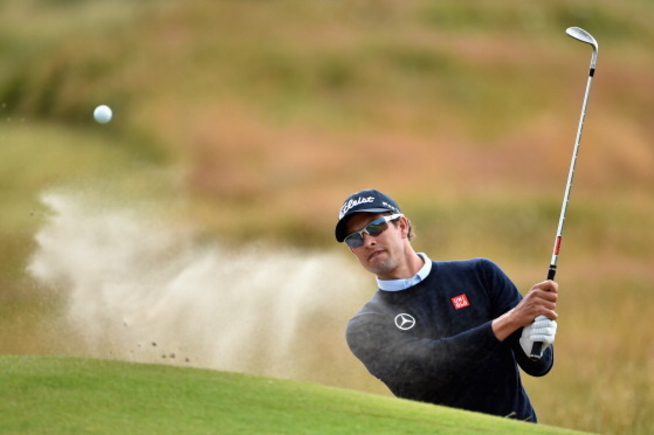 HOYLAKE, ENGLAND - JULY 14:  Adam Scott of Australia hits from a bunker during a practice round prior to the start of the 143rd Open Championship at Royal Liverpool on July 14, 2014 in Hoylake, England.  (Photo by Stuart Franklin/Getty Images)