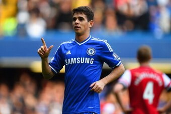 LONDON, ENGLAND - MARCH 22:  Oscar of Chelsea celebrates scoring their fifth goal during the Barclays Premier League match between Chelsea and Arsenal at Stamford Bridge on March 22, 2014 in London, England.  (Photo by Shaun Botterill/Getty Images)