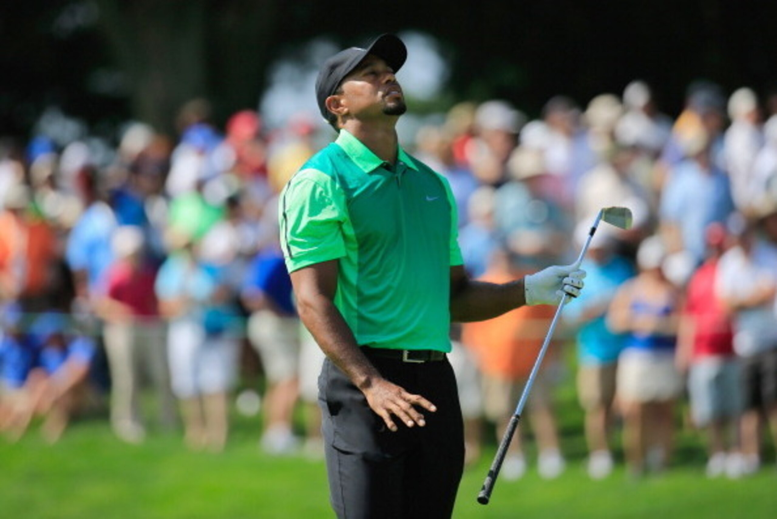 BETHESDA, MD - JUNE 26:  Tiger Woods of the United States reacts to his approach shot on the 17th hole during the first round of the Quicken Loans National at Congressional Country Club on June 26, 2014 in Bethesda, Maryland.  (Photo by Rob Carr/Getty Ima