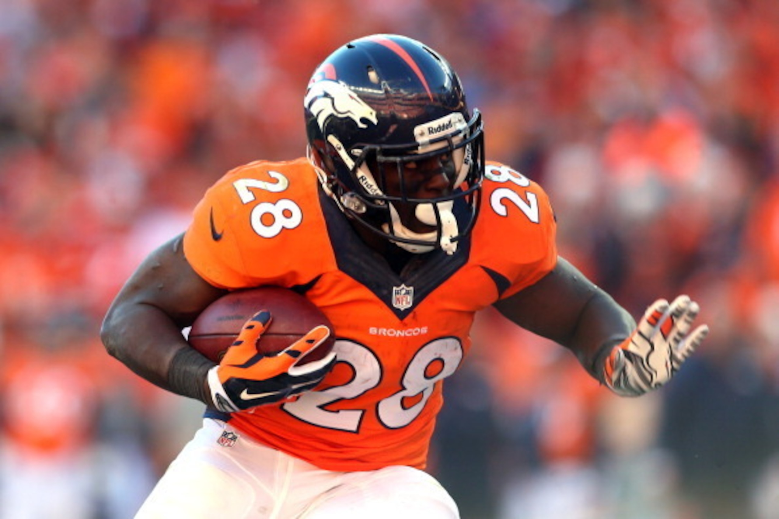 DENVER, CO - JANUARY 19:  Montee Ball #28 of the Denver Broncos runs with the ball against the New England Patriots during the AFC Championship game at Sports Authority Field at Mile High on January 19, 2014 in Denver, Colorado.  (Photo by Elsa/Getty Imag