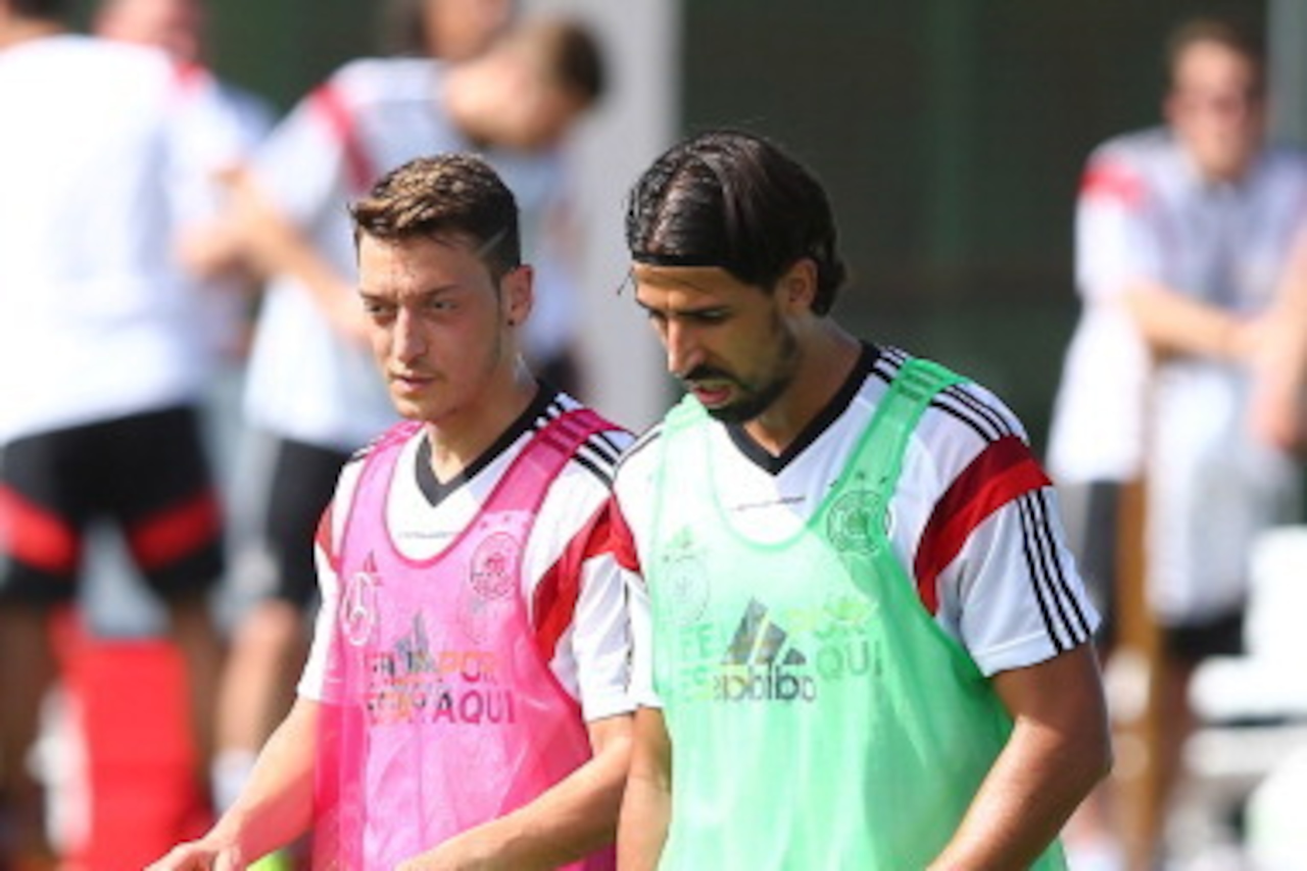 SANTO ANDRE, BRAZIL - JUNE 09: Mesut Oezil (L) talks to team mate Sami Khedira during the German National team training session at  Campo Bahia on June 9, 2014 in Santo Andre, Brazil.  (Photo by Martin Rose/Getty Images)