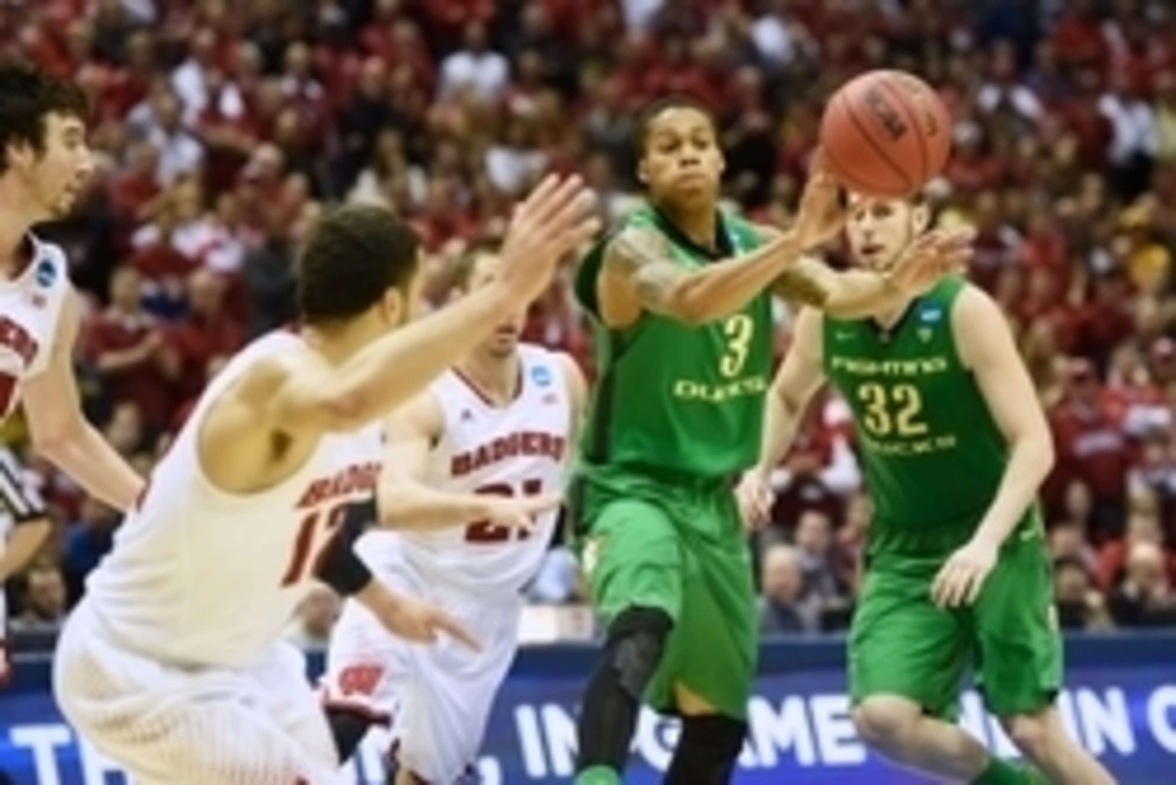 Mar 22, 2014; Milwaukee, WI, USA; Oregon Ducks guard Joseph Young (3) passes the ball in the second half of a men's college basketball game against the Wisconsin Badgers during the third round of the 2014 NCAA Tournament at BMO Harris Bradley Center. Mand Mar 22, 2014; Milwaukee, WI, USA; Oregon Ducks guard Joseph Young (3) passes the ball in the second half of a men's college basketball game against the Wisconsin Badgers during the third round of the 2014 NCAA Tournament at BMO Harris Bradley Center. Mand