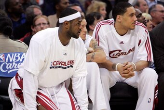 Dwayne Jones, far right, on the Cavs bench with LeBron James.
