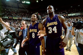 2001:  Shaquille O'Neal #34 and Kobe Bryant #8 of the Los Angeles Lakers walk off the court circa 2001. NOTE TO USER: User expressly acknowledges and agrees that, by downloading and/or using this Photograph, User is consenting to the terms and conditions 