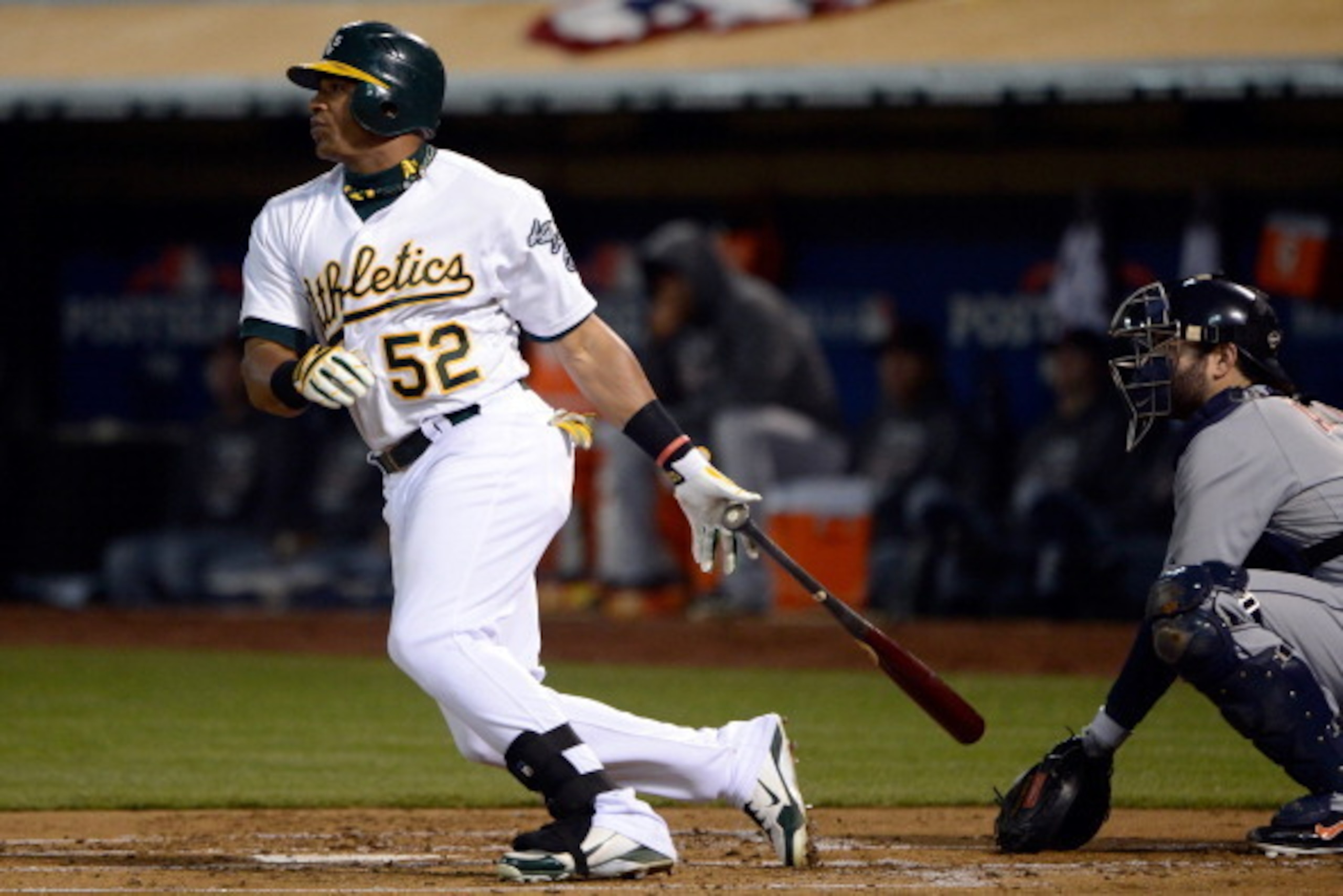 OAKLAND, CA - OCTOBER 11:  Yoenis Cespedes #52 of the Oakland Athletics hits a double in the first inning against the Detroit Tigers in Game Five of the American League Division Series at O.co Coliseum on October 11, 2012 in Oakland, California.  (Photo b