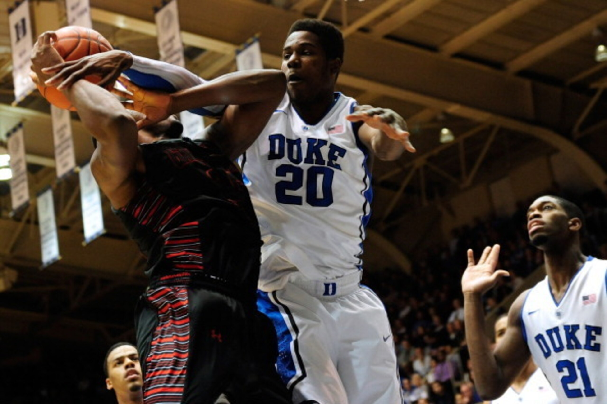 DURHAM, NC - DECEMBER 16: Semi Ojeleye #20 of the Duke Blue Devils fouls Jarvis Davis #15 of the Gardner-Webb Runnin' Bulldogs during play at Cameron Indoor Stadium on December 16, 2013 in Durham, North Carolina. Duke won 85-66. (Photo by Grant Halverso DURHAM, NC - DECEMBER 16: Semi Ojeleye #20 of the Duke Blue Devils fouls Jarvis Davis #15 of the Gardner-Webb Runnin' Bulldogs during play at Cameron Indoor Stadium on December 16, 2013 in Durham, North Carolina. Duke won 85-66. (Photo by Grant Halverso