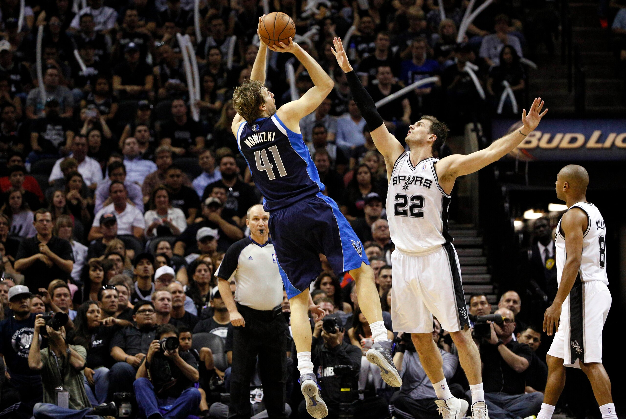 Apr 30, 2014; San Antonio, TX, USA; Dallas Mavericks player Dirk Nowitzki (41) shoots the ball over San Antonio Spurs forward Tiago Splitter (22) in game five of the first round of the 2014 NBA Playoffs at AT&T Center. The Spurs won 109-103. Mandatory Cre