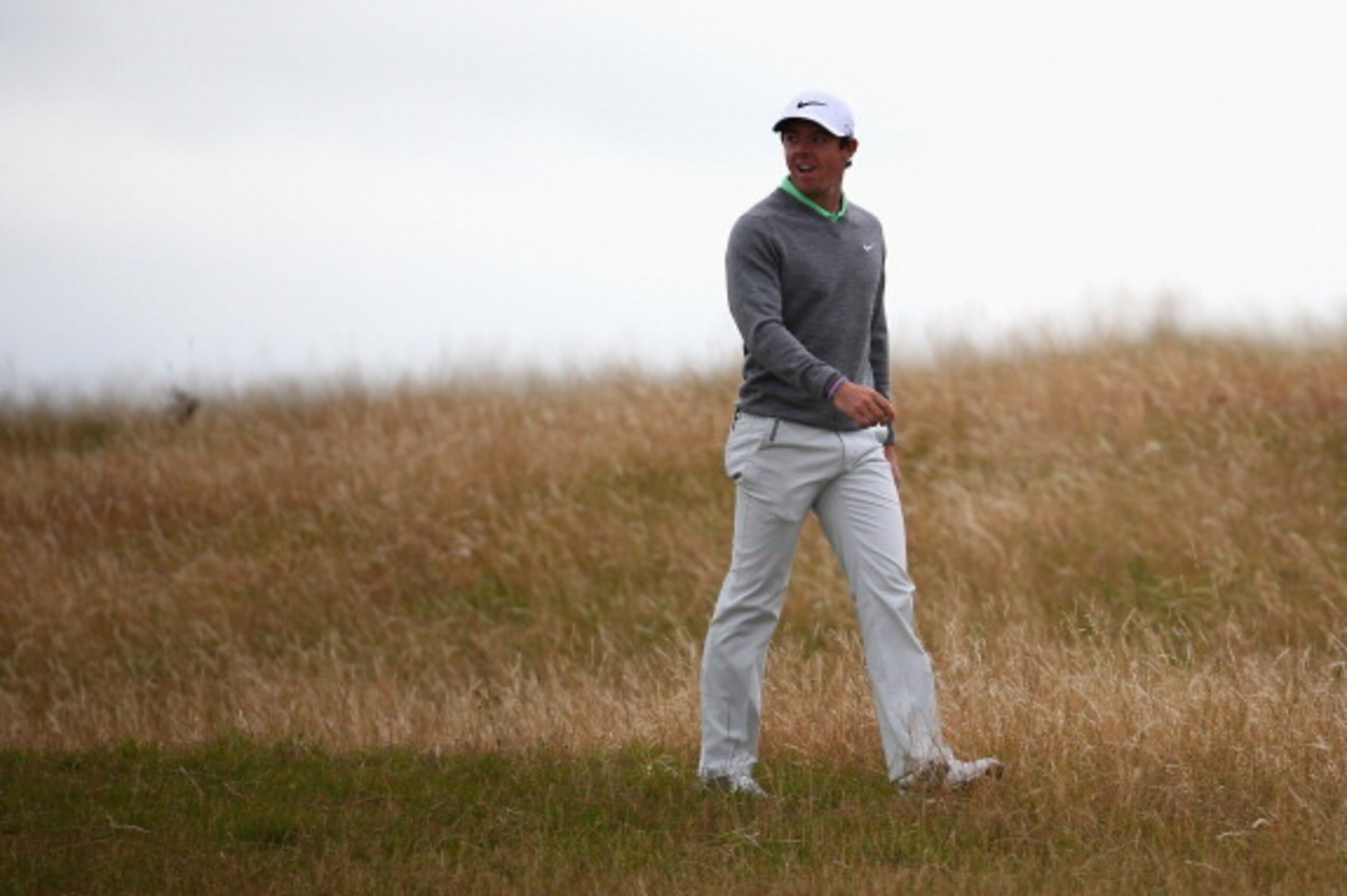 HOYLAKE, ENGLAND - JULY 16:  Rory McIlroy of Northern Ireland walks in the rough during a practice round prior to the start of The 143rd Open Championship at Royal Liverpool on July 16, 2014 in Hoylake, England.  (Photo by Matthew Lewis/Getty Images)