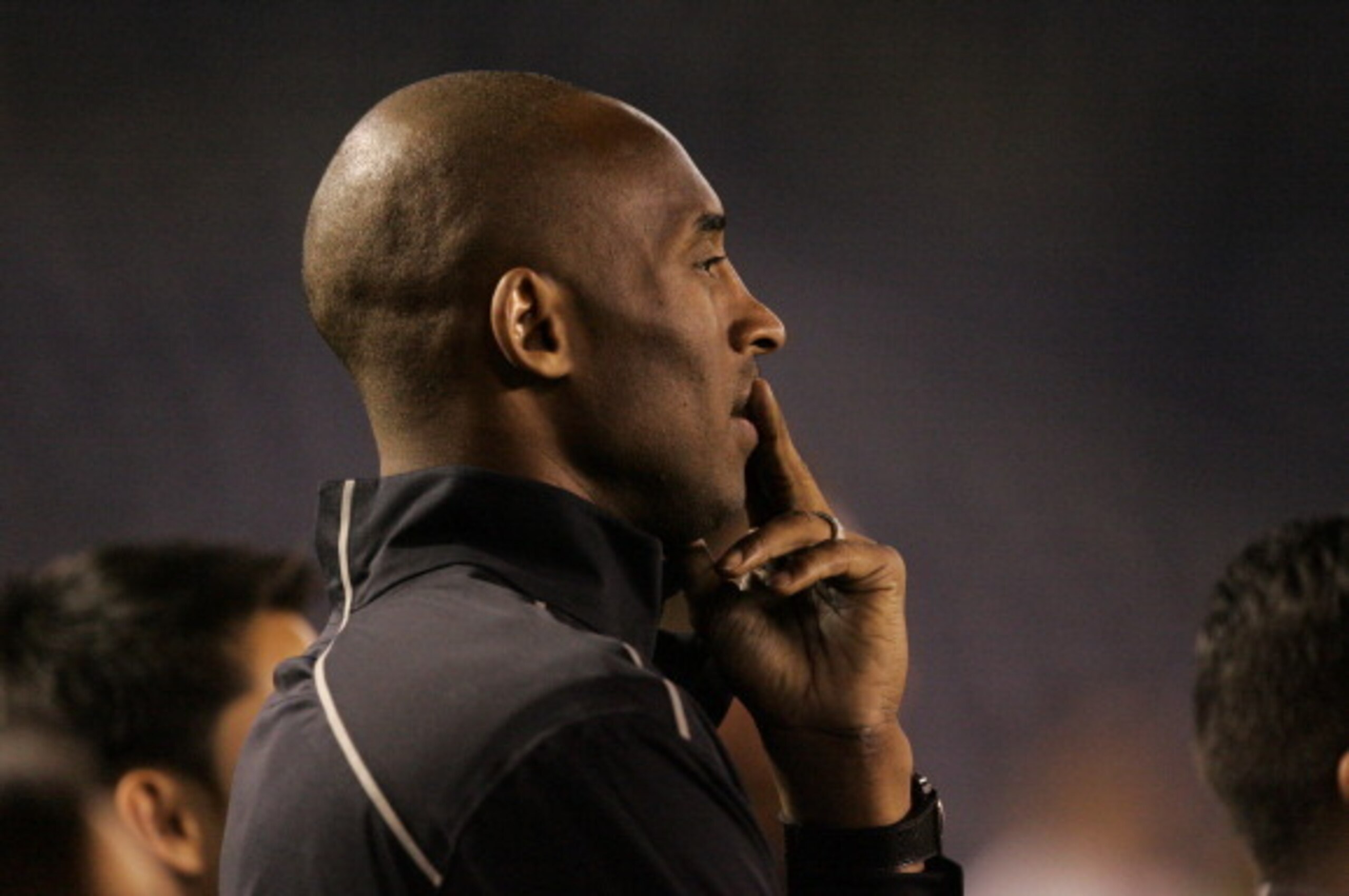 SAN DIEGO, CA - APRIL 10:  NBA Los Angeles Laker Kobe Bryant stands on the sideline prior to the start of the game against the United States and China during an international firendly match at Qualcomm Stadium on April 10, 2014 in San Diego, California. (