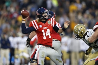 NASHVILLE, TN - DECEMBER 30: Bo Wallace #14 of the Ole Miss Rebels passes the ball against the Georgia Tech Yellow Jackets during the Franklin American Mortgage Music City Bowl at LP Field on December 30, 2013 in Nashville, Tennessee. Ole Miss won the gam
