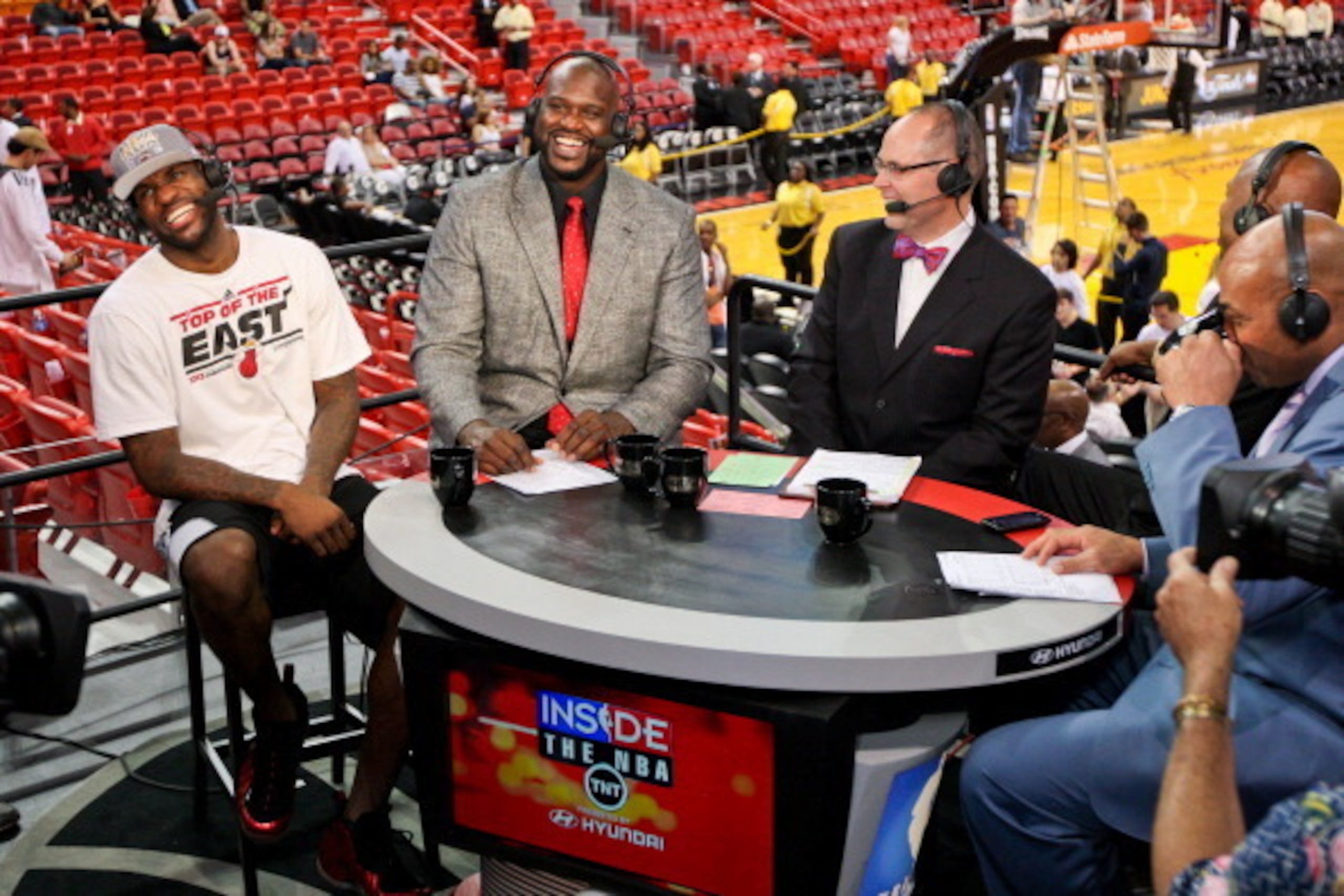 MIAMI, FL - JUNE 3: LeBron James #6 of the Miami Heat, from left, laughs while being interviewed by TNT analysts Shaquille O'Neal, Ernie Johnson Jr., Kenny Smith and Charles Barkley following the Heat's series victory against the Indiana Pacers in Game Se