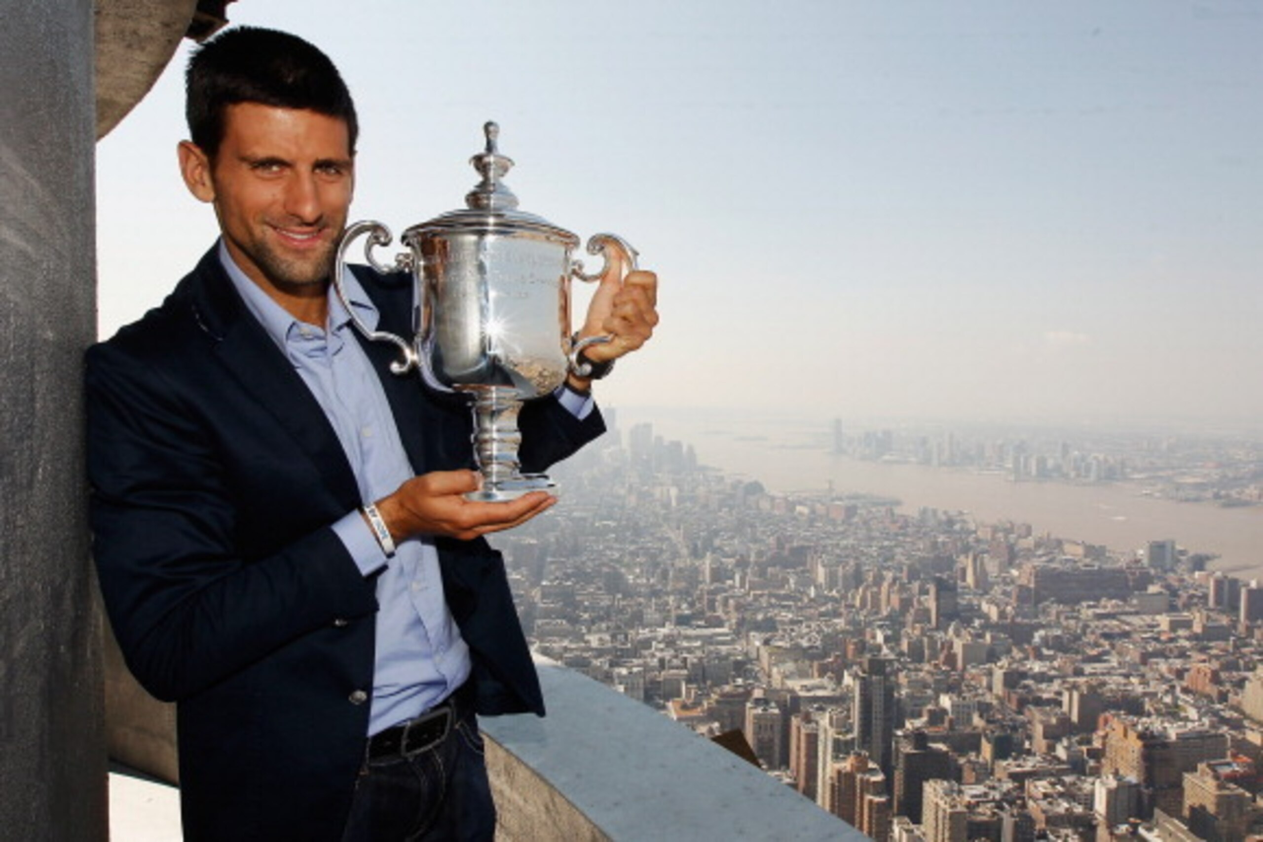 NEW YORK, NY - SEPTEMBER 13:  2011 US Open Singles Men's Champion Novak Djokovic of Serbia poses with his trophy atop the Empire State Building on September 13, 2011 in New York City, New York. Djokovic defeated Rafael Nadal of Spain in 4 sets during thei