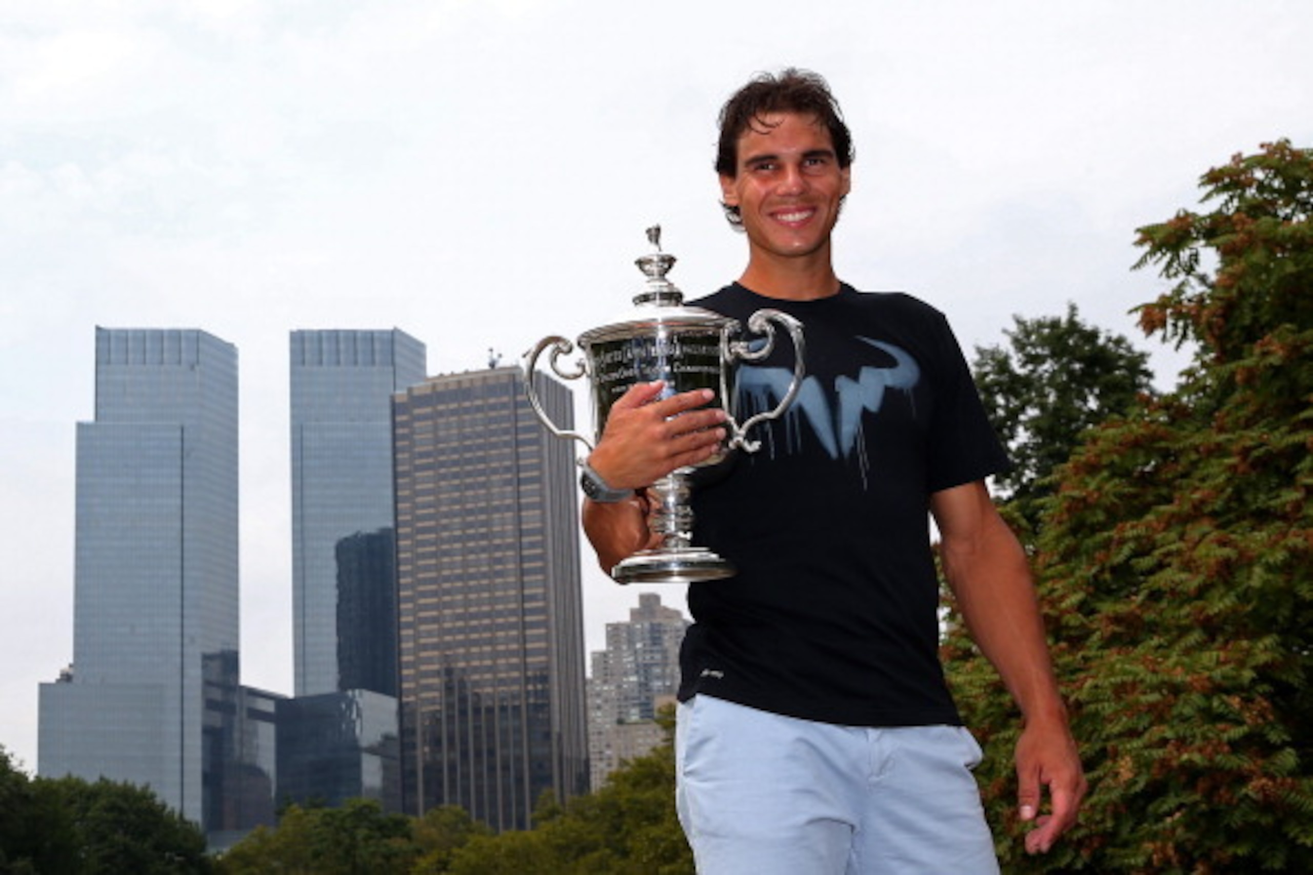 NEW YORK, NY - SEPTEMBER 10:  2013 US Open Champion Rafael Nadal of Spain poses with the US Open Championship trophy, following his victory in the men's singles final match against Novak Djokovic of Serbia, in Central Park on September 10, 2013 in New Yor