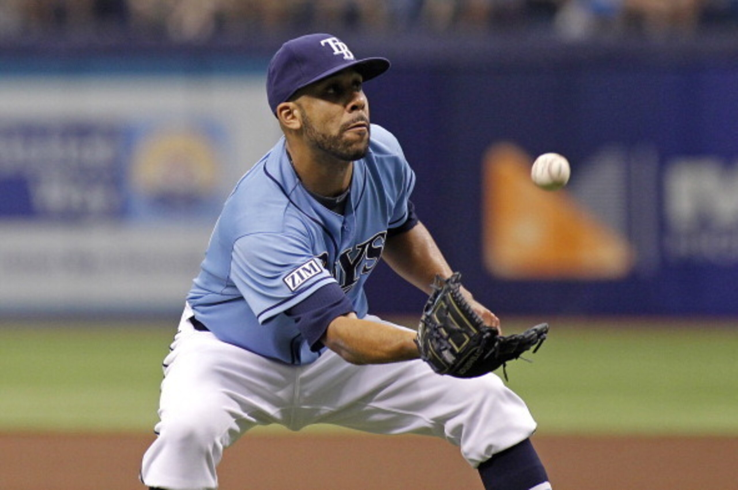 ST. PETERSBURG, FL - JULY 13:  Pitcher David Price #14 of the Tampa Bay Rays hauls in the pop out by Dan Johnson #16 of the Toronto Blue Jays during the first inning of a game on July 13, 2014 at Tropicana Field in St. Petersburg, Florida.  (Photo by Bria