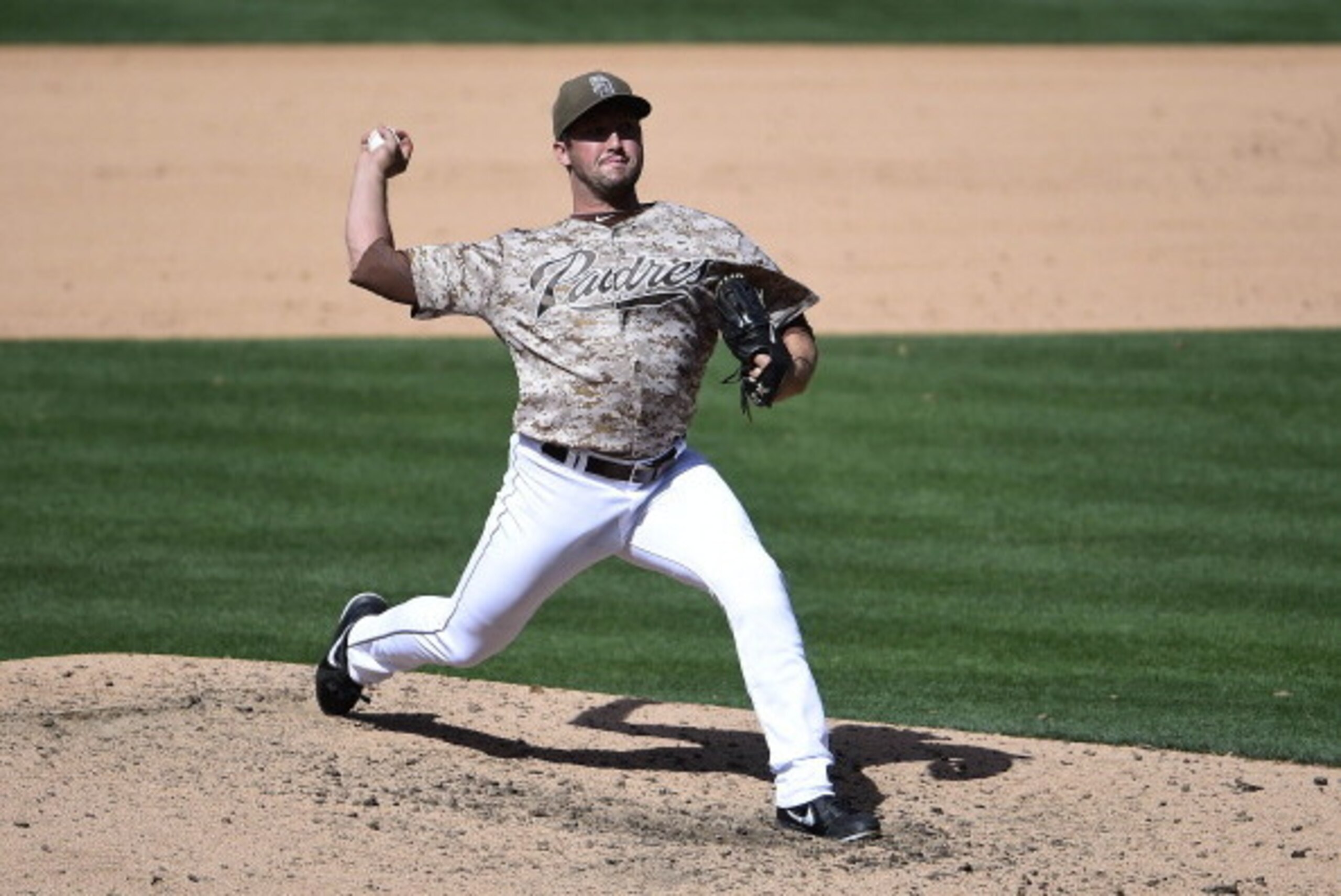 SAN DIEGO, CA - MAY 4:  Huston Street #16 of the San Diego Padres pitches during the ninth inning of a baseball game against the Arizona Diamondbacks at Petco Park May 4, 2014 in San Diego, California.  (Photo by Denis Poroy/Getty Images)