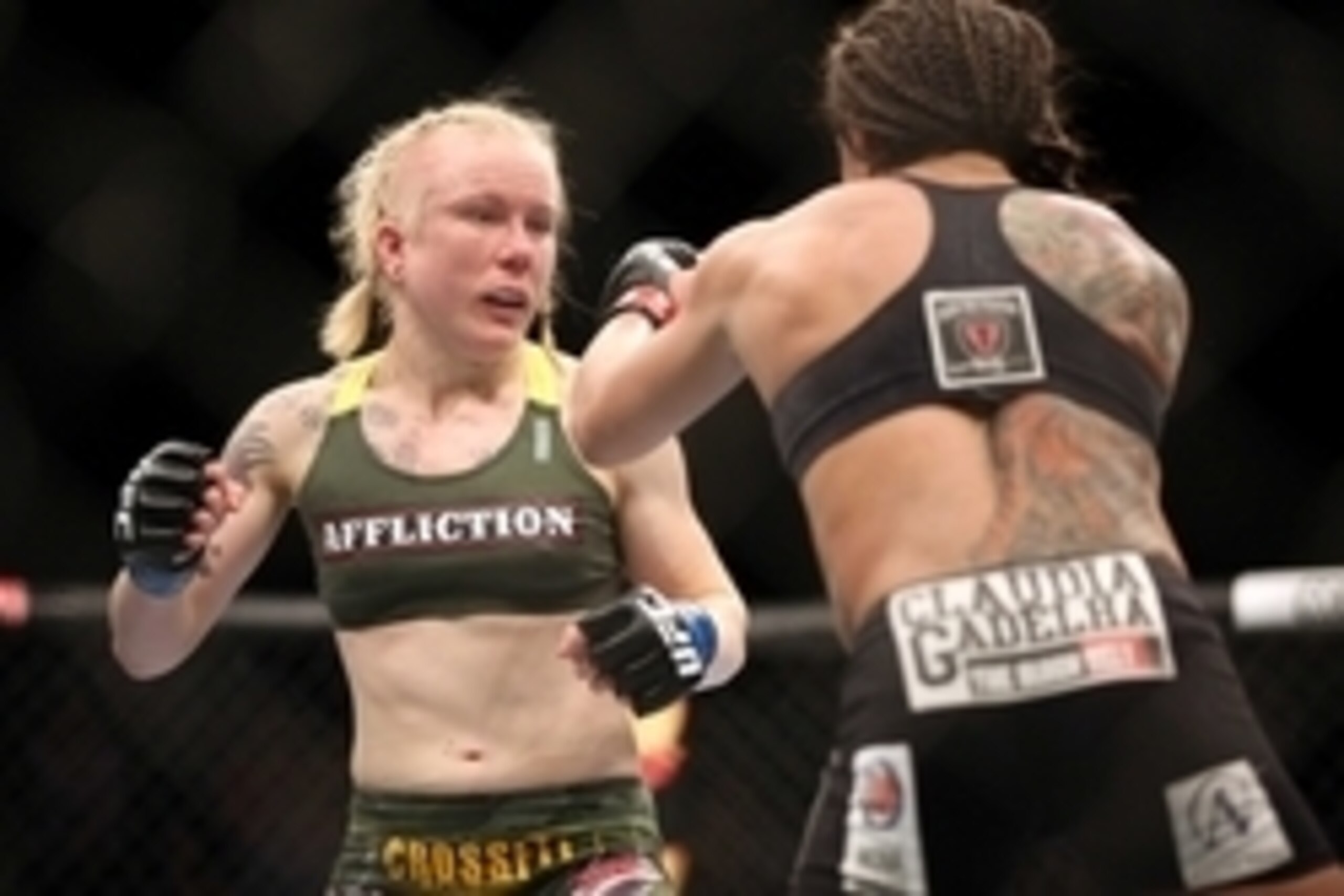 Jul 16, 2014; Atlantic City, NJ, USA; Tina Lahdemaki (blue gloves) faces off against Claudia Gadelha (red gloves) during a 115-pound women's division bout at Revel Casino. Mandatory Credit: Bill Streicher-USA TODAY Sports Jul 16, 2014; Atlantic City, NJ, USA; Tina Lahdemaki (blue gloves) faces off against Claudia Gadelha (red gloves) during a 115-pound women's division bout at Revel Casino. Mandatory Credit: Bill Streicher-USA TODAY Sports