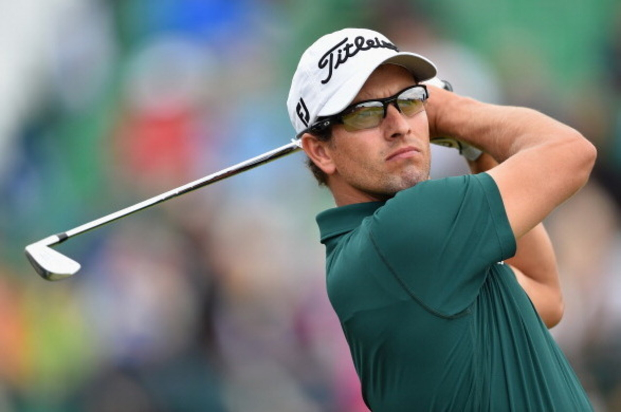 HOYLAKE, ENGLAND - JULY 16:  Adam Scott of Australia tees off during a practice round prior to the start of The 143rd Open Championship at Royal Liverpool on July 16, 2014 in Hoylake, England.  (Photo by Stuart Franklin/Getty Images)