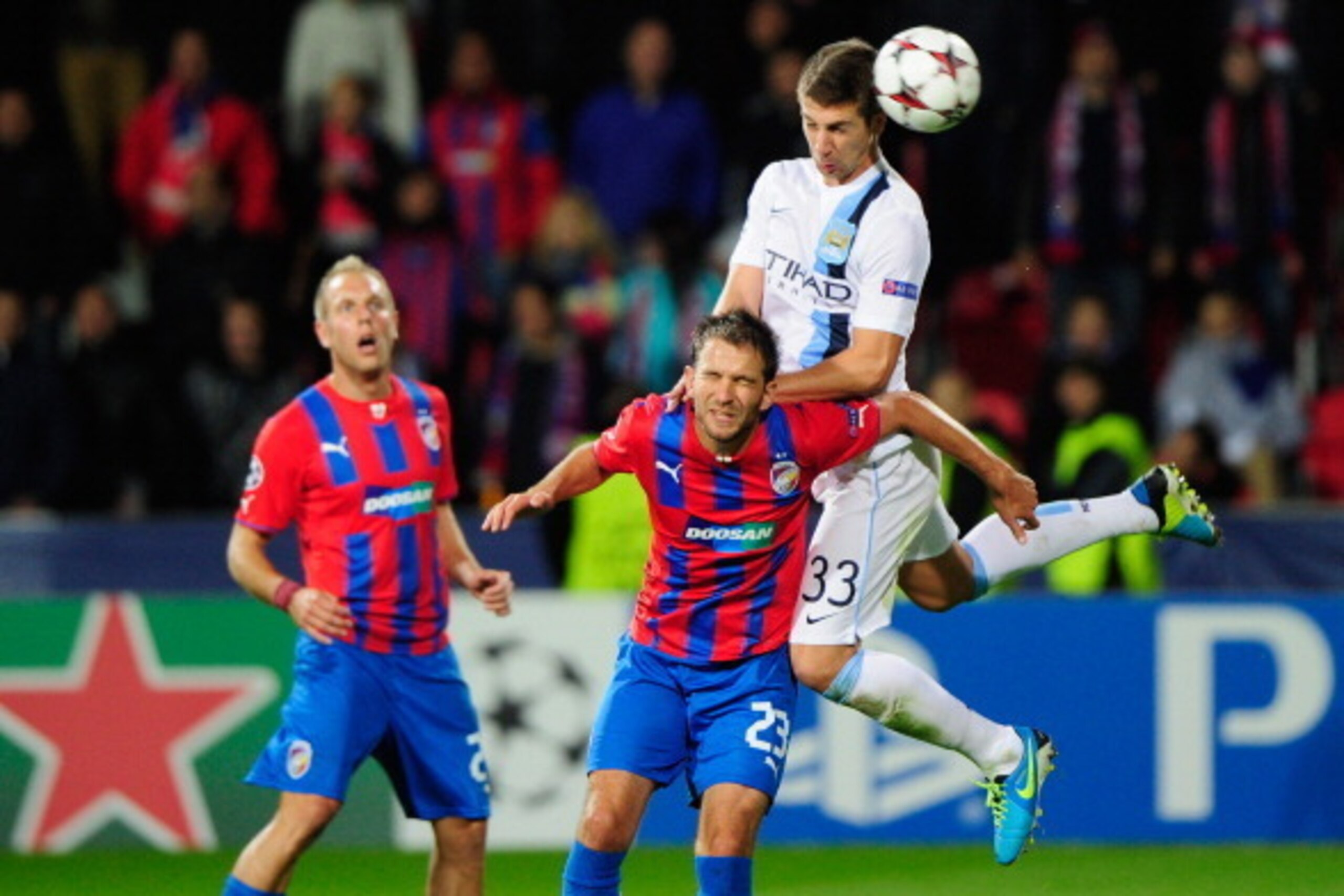 PLZEN, CZECH REPUBLIC - SEPTEMBER 17:  Marek Bakos (C) of Plzen challenges Matija Nastasic (R) of Manchester during the UEFA Champions League match between FC Viktoria Plzen and Manchester City on September 17, 2013 in Plzen, Czech Republic.  (Photo by Le