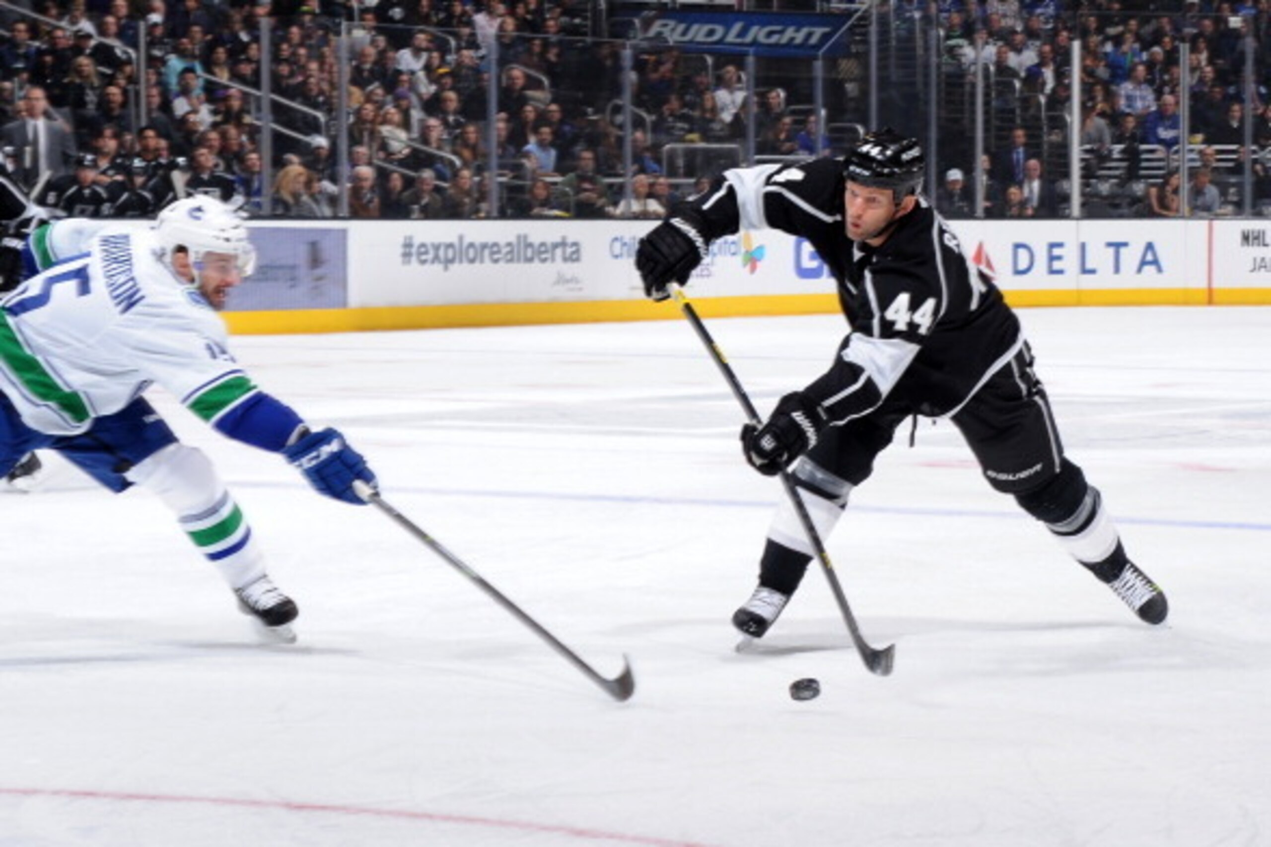 LOS ANGELES, CA - JANUARY 13:  Robyn Regehr #44 of the Los Angeles Kings shoots the puck against the Vancouver Canucks at Staples Center on January 13, 2014 in Los Angeles, California. (Photo by Noah Graham/NHLI via Getty Images)