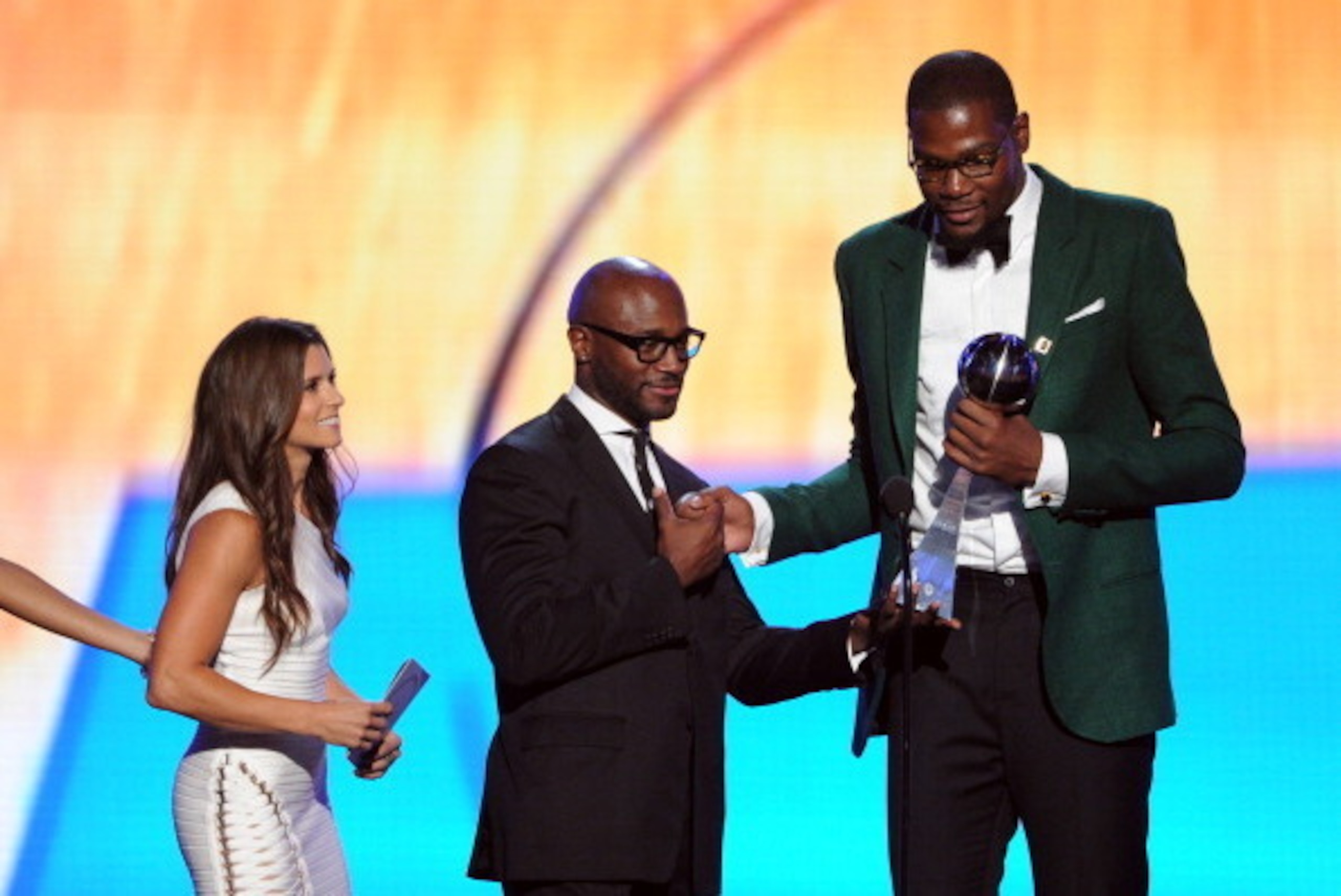 LOS ANGELES, CA - JULY 16:  NBA player Kevin Durant (R) accepts the Best Male Athlete Award onstage with NASCAR driver Danica Patrick and actor Taye Diggs during the 2014 ESPYS at Nokia Theatre L.A. Live on July 16, 2014 in Los Angeles, California.  (Phot