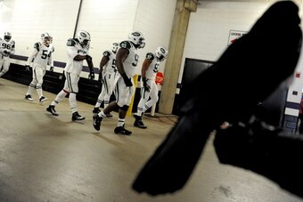 BALTIMORE, MD - NOVEMBER 24: Defensive end Kenrick Ellis #93 of the New York Jets and teammates take the field for warmups before playing the Baltimore Ravens at M&T Bank Stadium on November 24, 2013 in Baltimore, Maryland. (Photo by Patrick Smith/Getty I