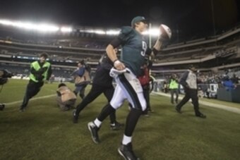 Dec 22, 2013; Philadelphia, PA, USA; Philadelphia Eagles quarterback Nick Foles (9) runs off the field after the game at Lincoln Financial Field. Philadelphia Eagles defeated the Chicago Bears 54-11. Mandatory Credit: Tommy Gilligan-USA TODAY Sports