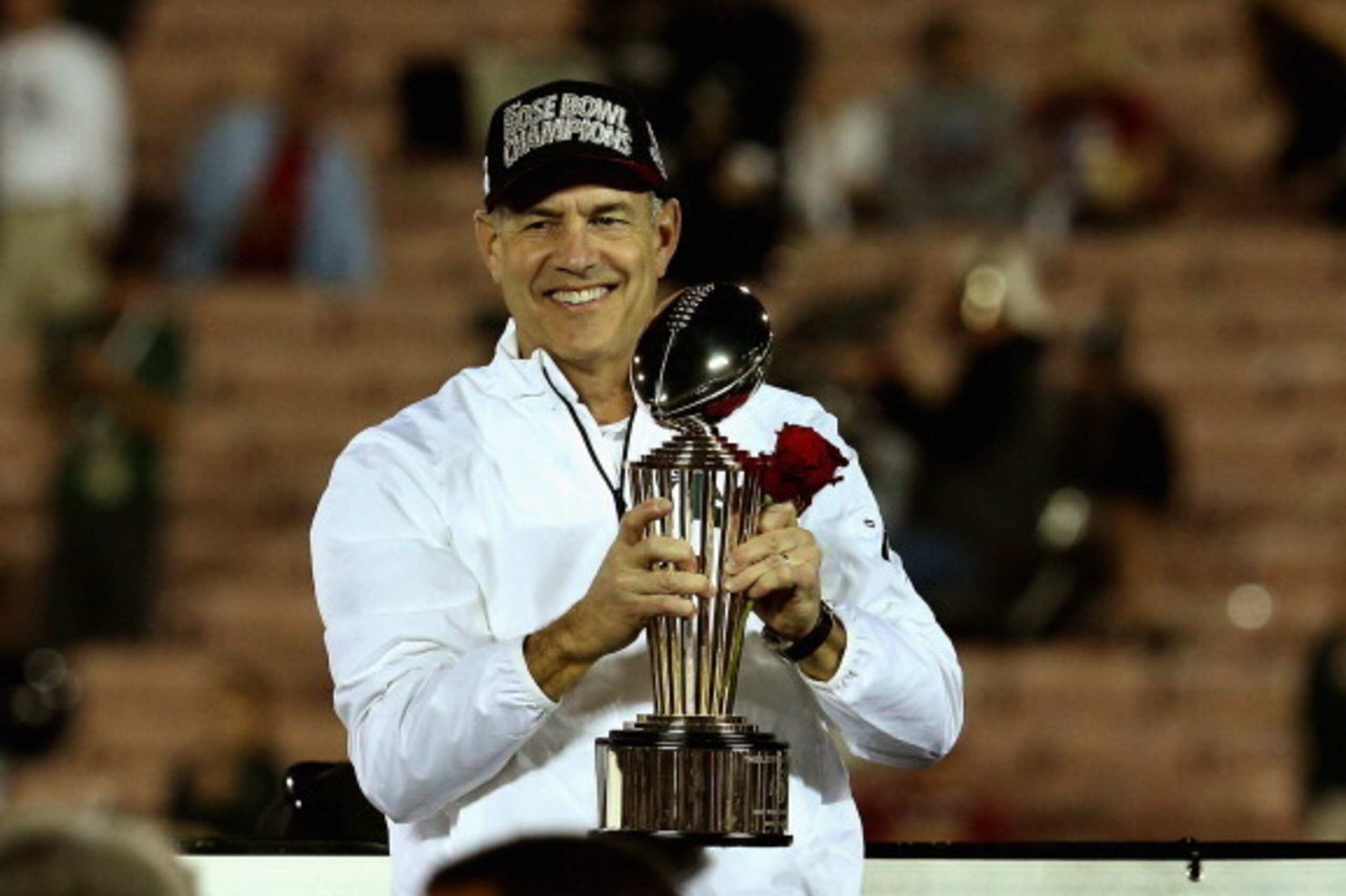 PASADENA, CA - JANUARY 01:  Michigan State Spartans head coach Mark Dantonio celebrates with the Rose Bowl Game trophy after defeating the Stanford Cardinal 24-20 in the 100th Rose Bowl Game presented by Vizio at the Rose Bowl on January 1, 2014 in Pasade