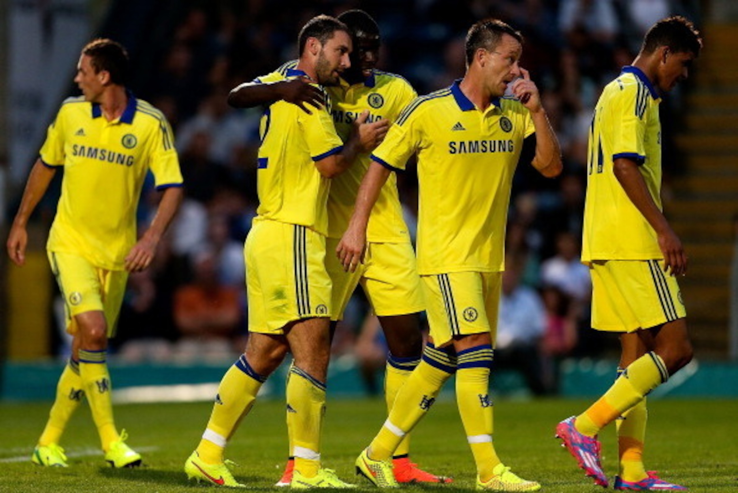 HIGH WYCOMBE, ENGLAND - JULY 16: Branislav Ivanovic of Chelsea celebrates with team mates after scoring a goal duing the pre season friendly match between Wycombe Wanderers and Chelsea at Adams Park on July 16, 2014 in High Wycombe, England.  (Photo by Be