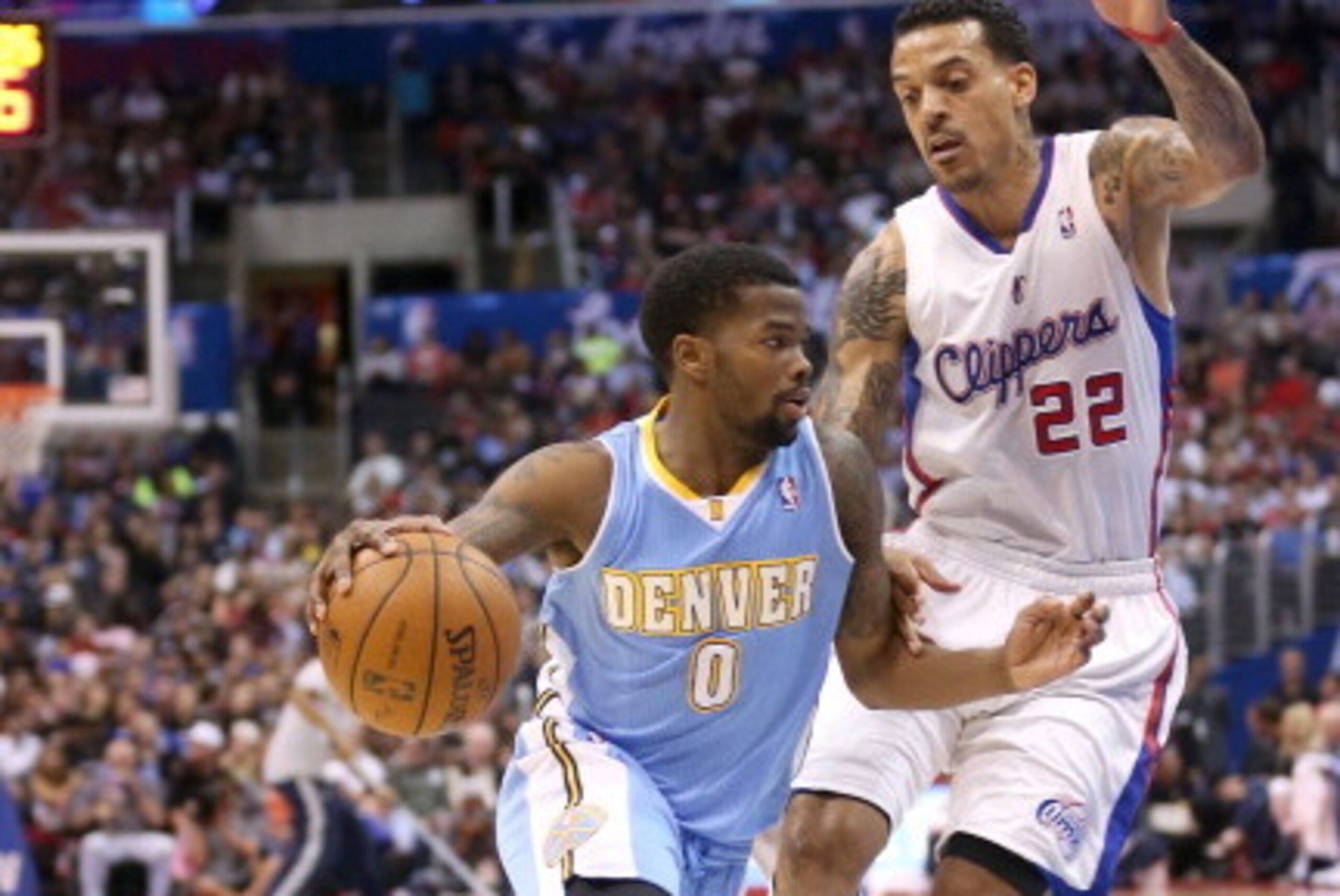 LOS ANGELES, CA - APRIL 15: Aaron Brooks #0 of the Denver Nuggets drives past Matt Barnes #22 of the Los Angeles Clippers at Staples Center on April 15, 2014 in Los Angeles, California. NOTE TO USER: User expressly acknowledges and agrees that, by downl LOS ANGELES, CA - APRIL 15: Aaron Brooks #0 of the Denver Nuggets drives past Matt Barnes #22 of the Los Angeles Clippers at Staples Center on April 15, 2014 in Los Angeles, California. NOTE TO USER: User expressly acknowledges and agrees that, by downl